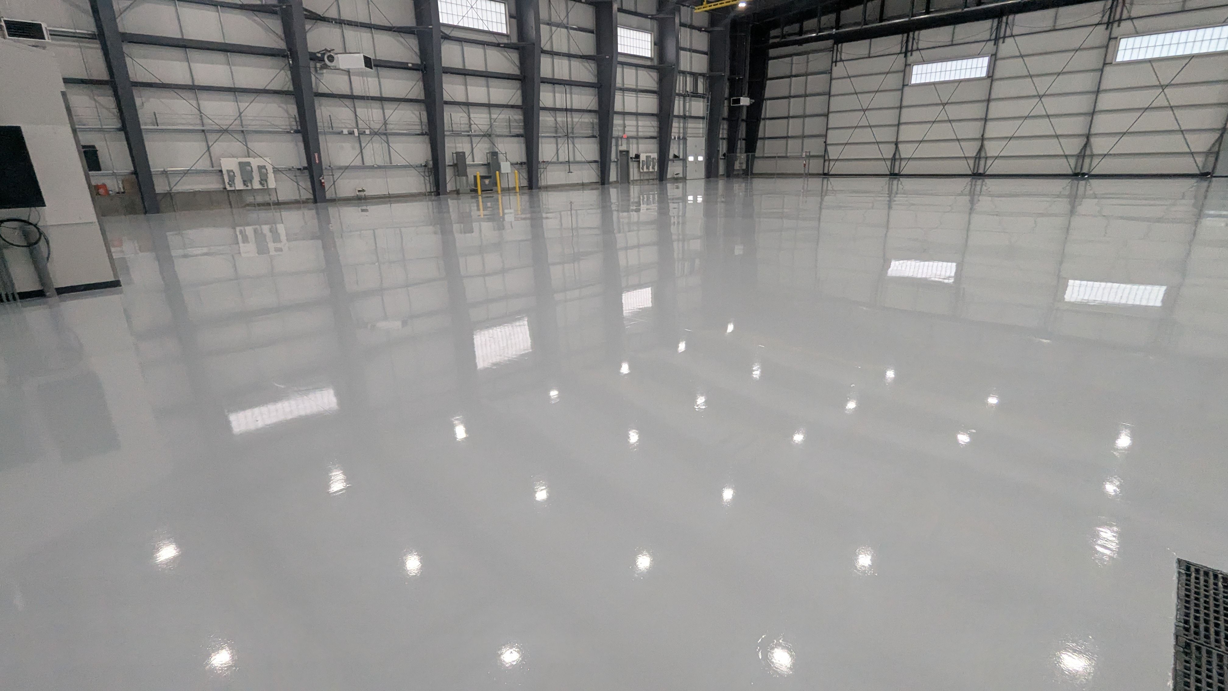Airplane Hanger using Light Grey Commercial Penntek Epoxy by Croc Coatings, LLC
