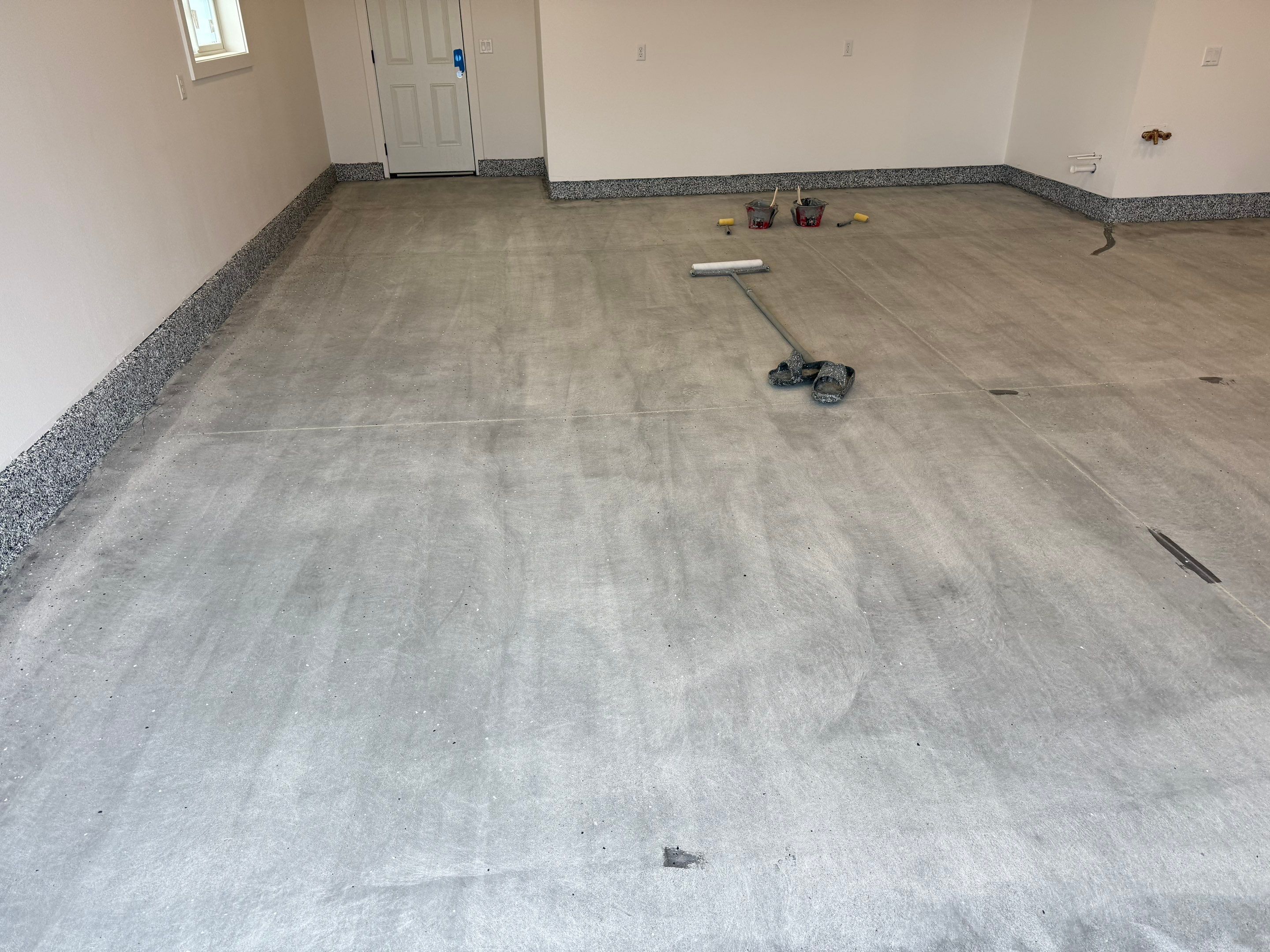 Multi-Car Garage Epoxy Floor Coating and Concrete Finishing in Sioux Falls by Select Painting, Coatings & Garage Cabinets