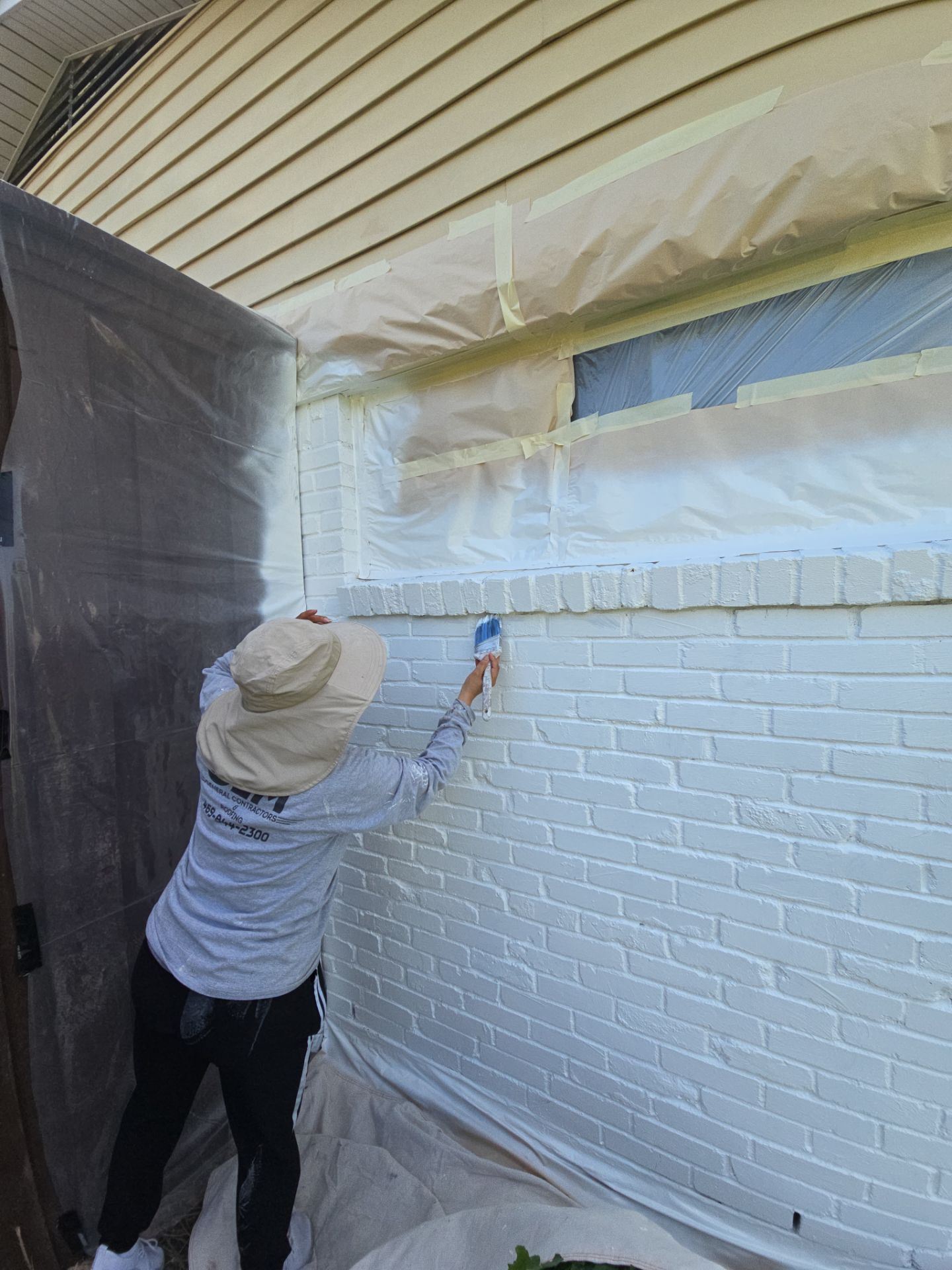 Exterior Home Paint Project with Different Surfaces by SLM General Contractors & Roofing