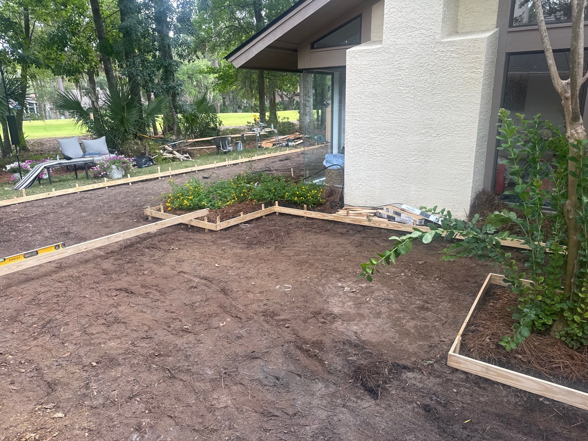 Custom Concrete Patio and Herringbone Paver Walkway in Hilton Head Island by Lowcountry Scapes, LLC