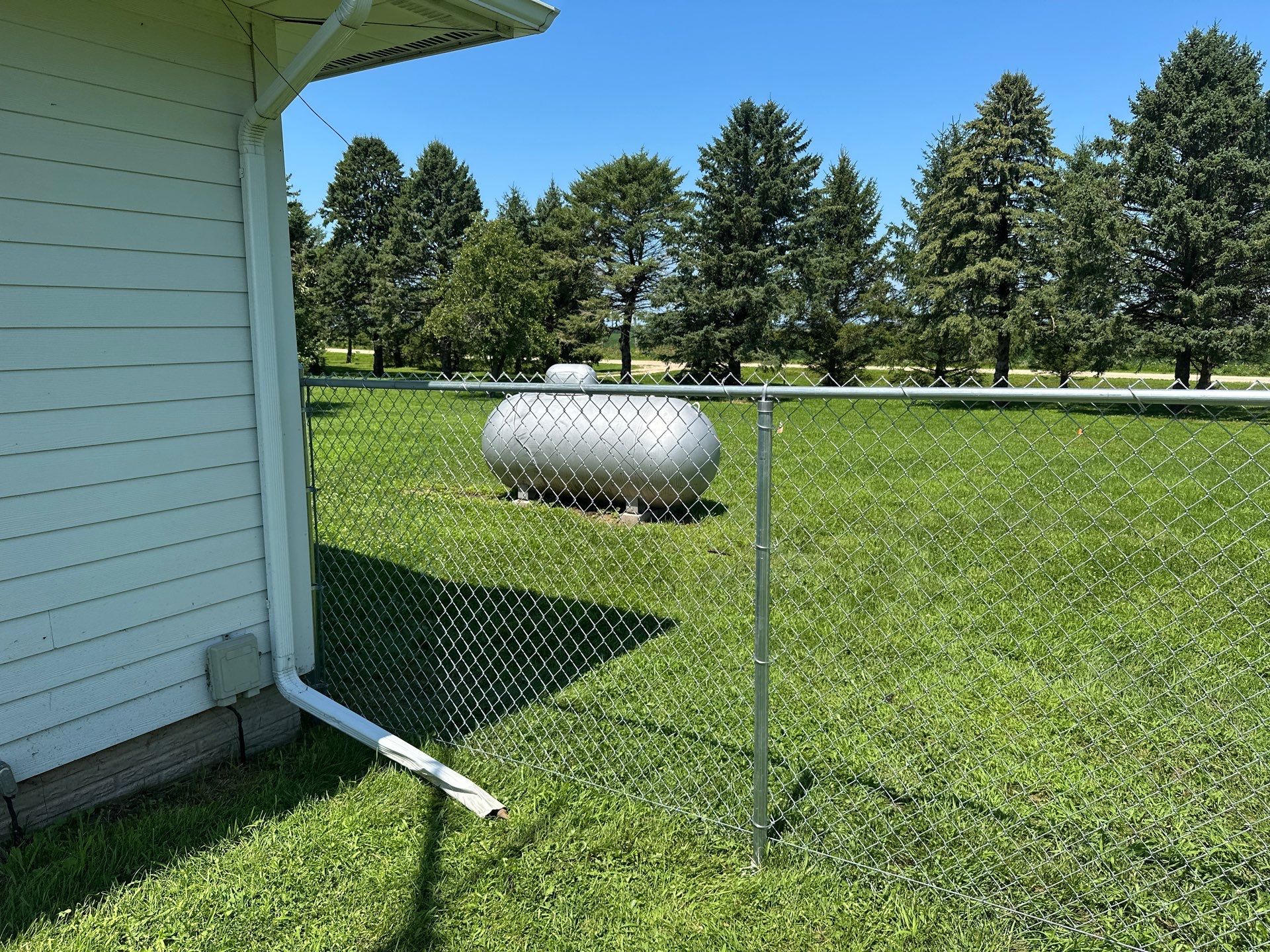 Residential Galvanized Chain Link Perimeter Fence Installation in New Hartford by Perfect Picket Fence and Stain