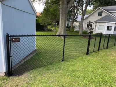 Black Chain Link Perimeter Fence and Gate Installation in Shell Rock