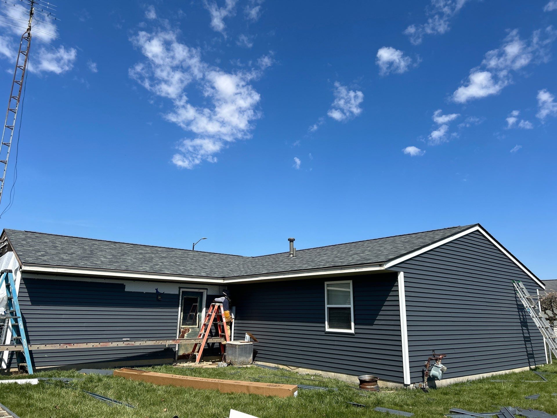 Storm Damage Residential Roof and Siding Installation by WIW Enterprises Inc