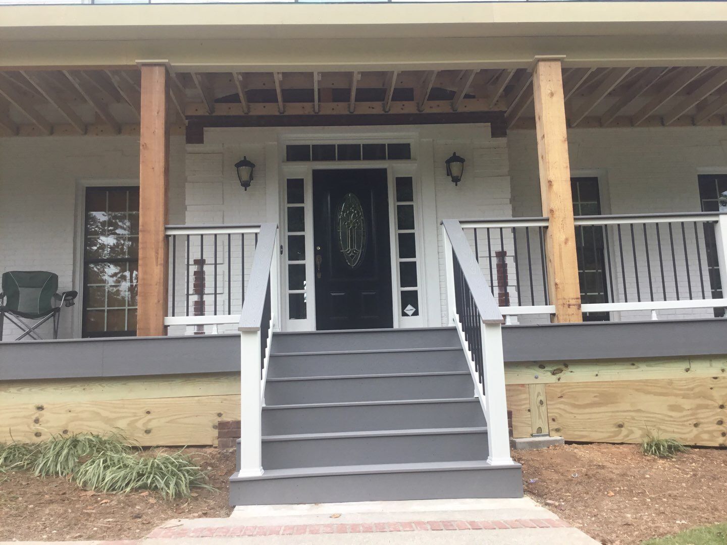 Custom Front Porch Construction with White Railing in Dunwoody by Swift Home Renovations
