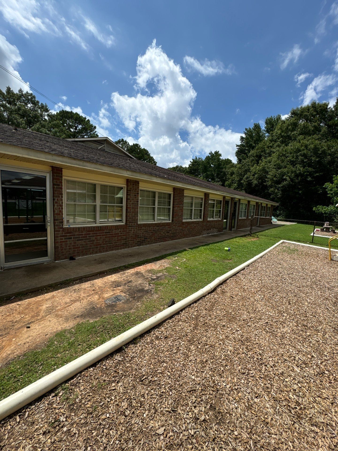 Commercial Exterior Brick and Stucco Painting in Fayetteville by Swift Home Renovations