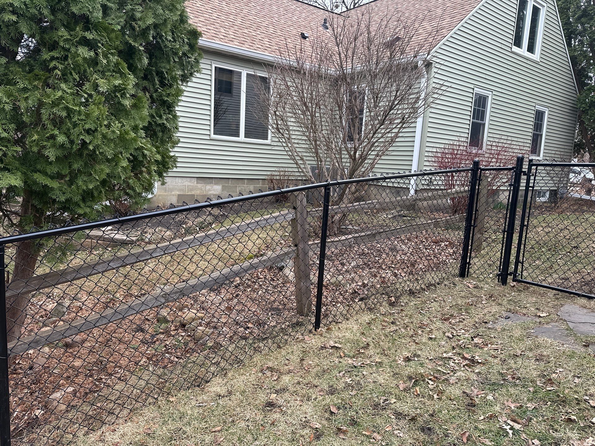 Black Vinyl Chain Link Fence Installation in Cedar Falls by Perfect Picket Fence and Stain