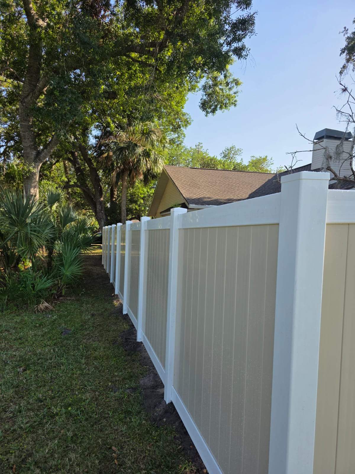 Two-Tone Vinyl Privacy Fence Installation in Port Charlotte by True Fence LLC