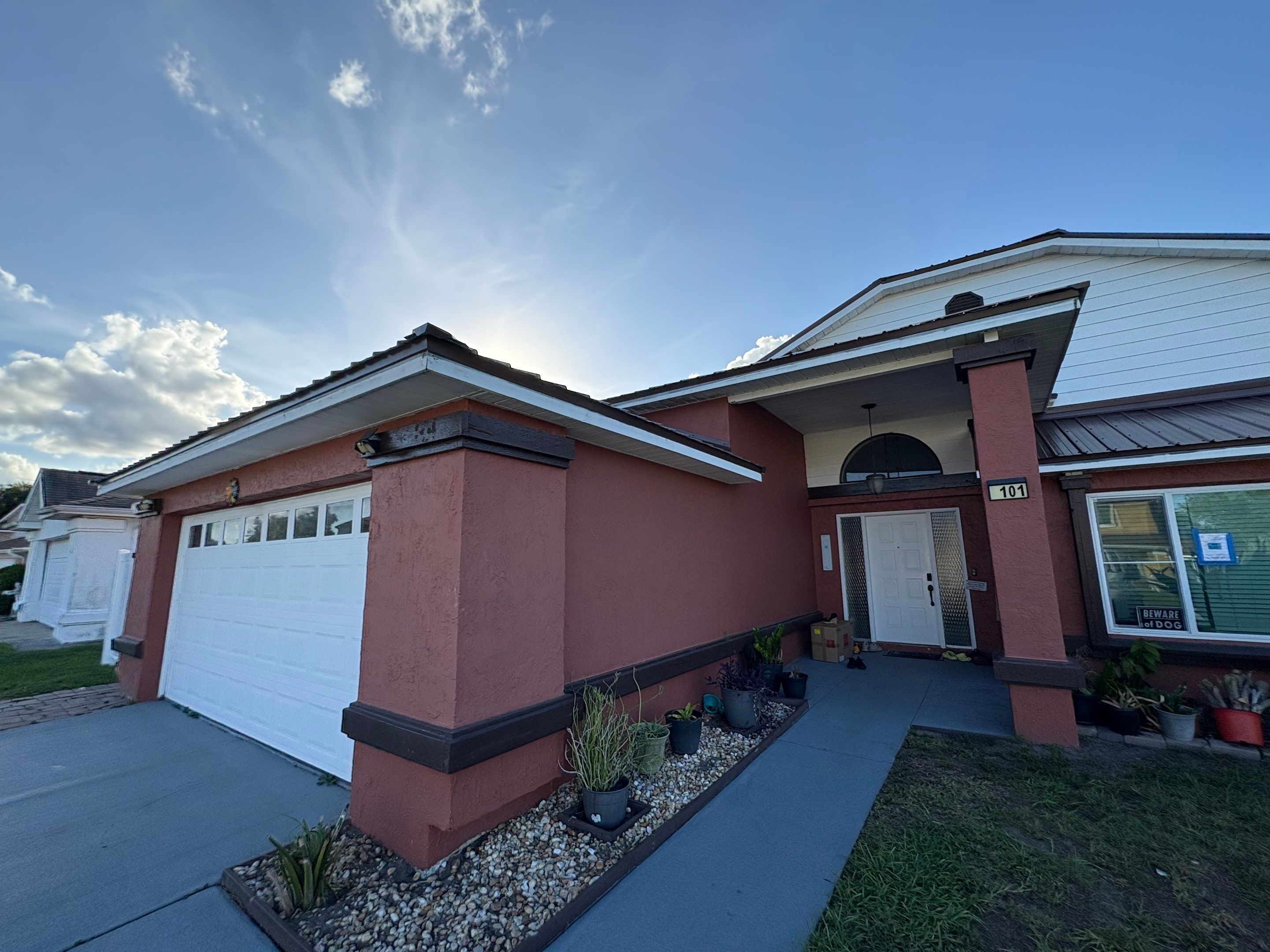 Residential Metal Roofing Installation and Gutter Replacement in Kissimmee by Pinnacle Roofing Group