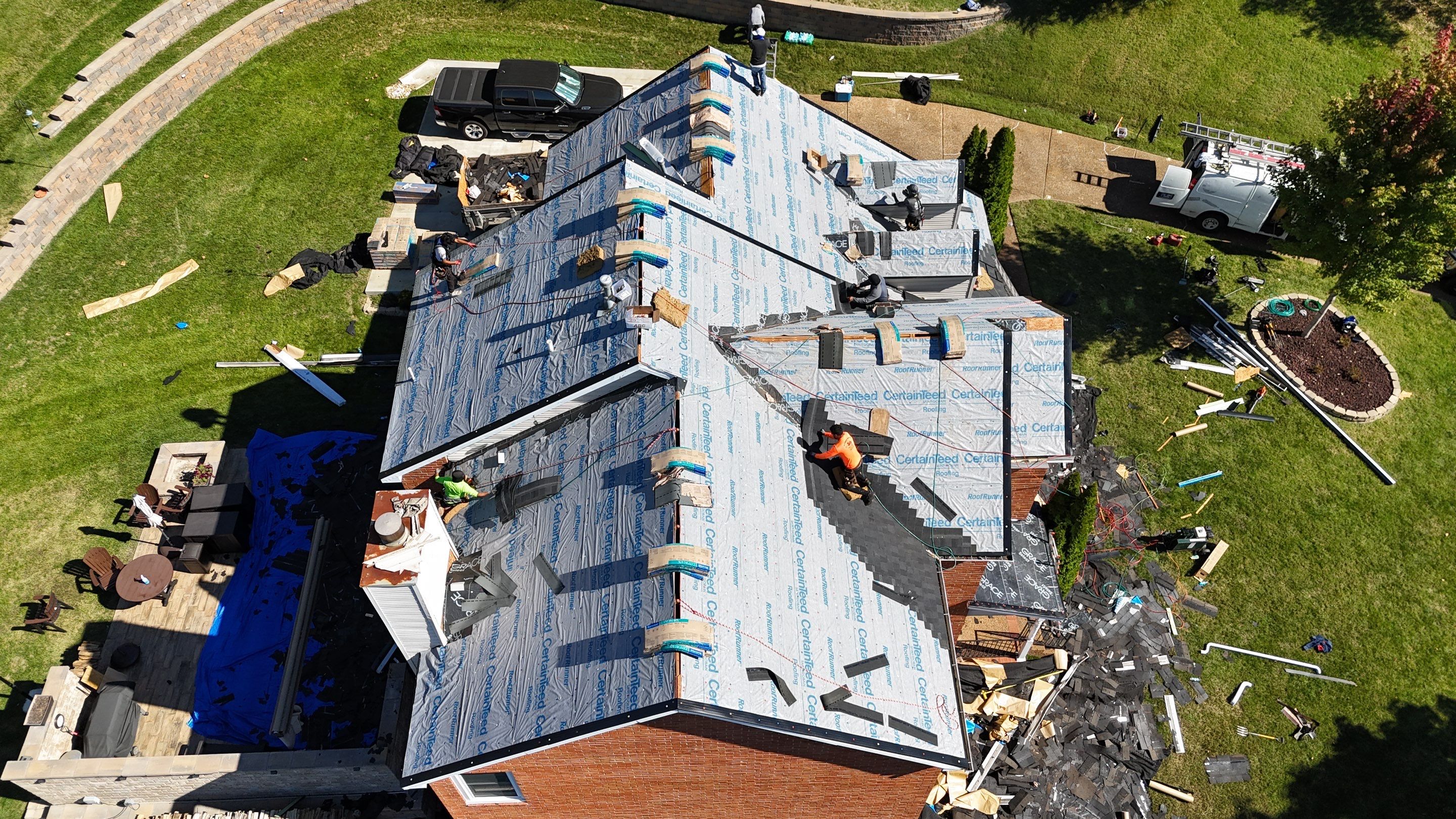 Charcoal Black Re-Roof & Gutters by Royal House LLC
