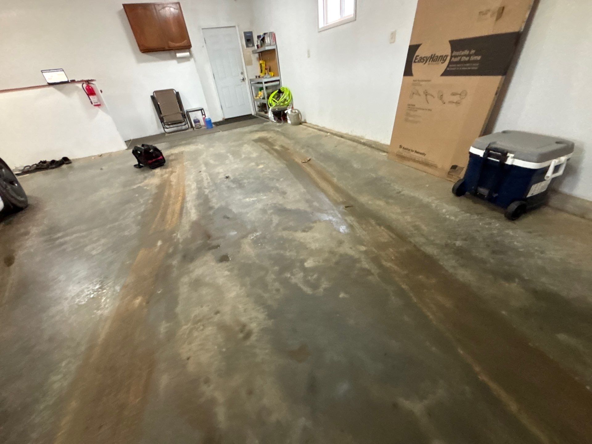 Full Garage Floor and Basement Stair Epoxy Coating in Sioux Falls by Select Painting, Coatings & Garage Cabinets