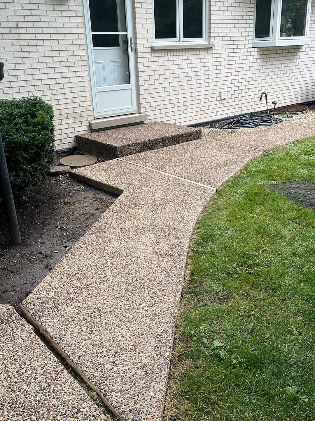 Aggregate concrete cleaning and sealing using Surebond SB-9000 by Northern Power Washing LLC.