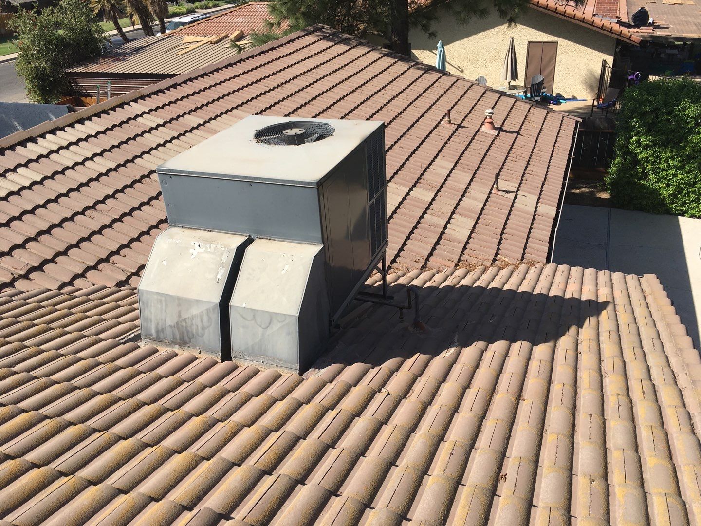 Tile roof remodel/ install OSB sheathing under tile and replace using OSB board with new underlayment, tile, and battens by Straight Edge Roofing Inc