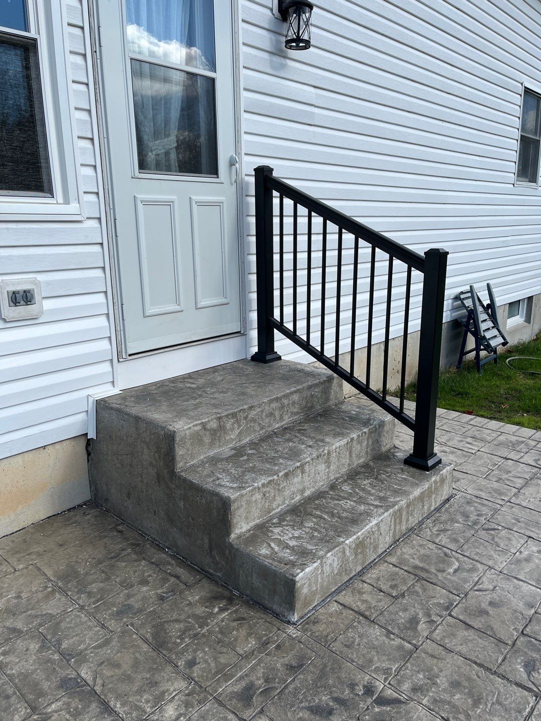 Stamped Concrete and Entry Door by Ivy Lea Construction