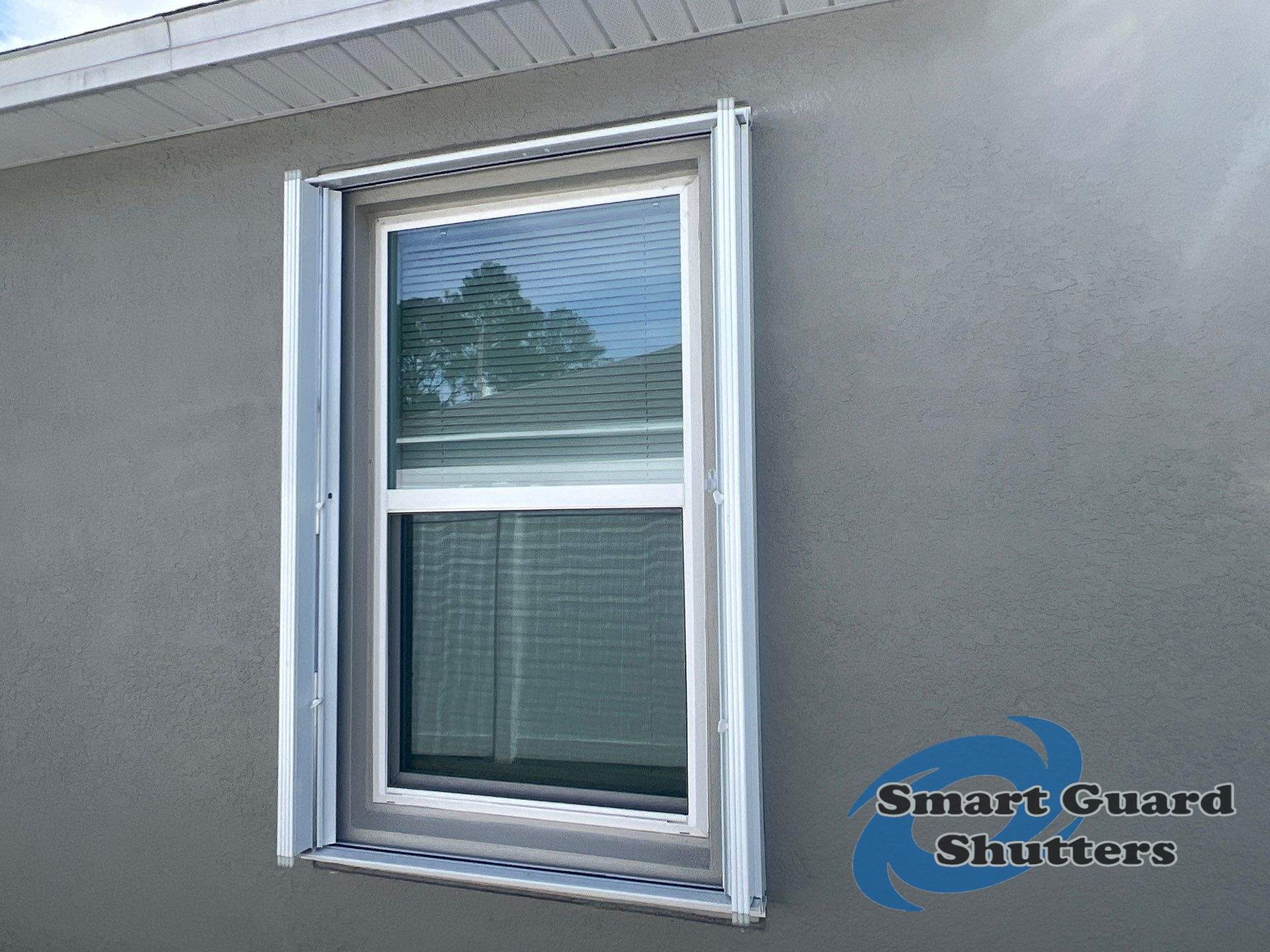 Accordion Shutters in White by Smart Guard Shutters