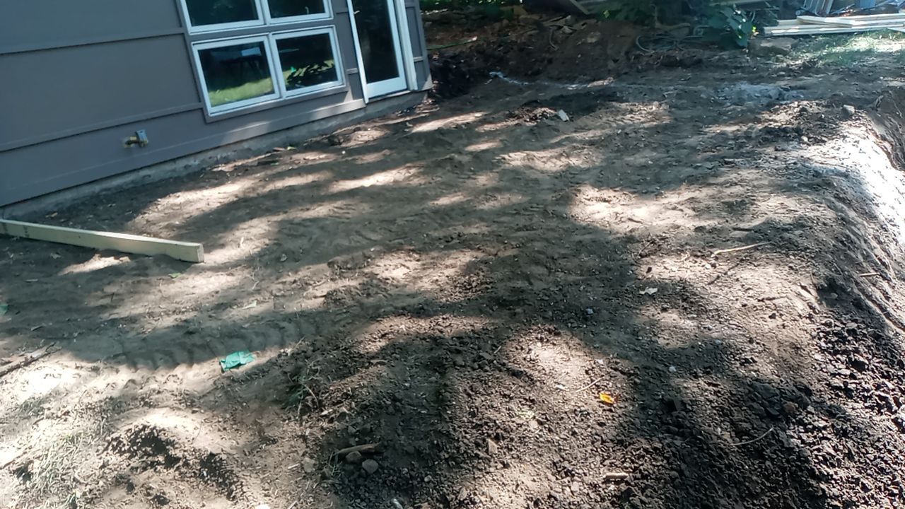 Back Yard Cantilivered Patio by LAND ESCAPES LLC