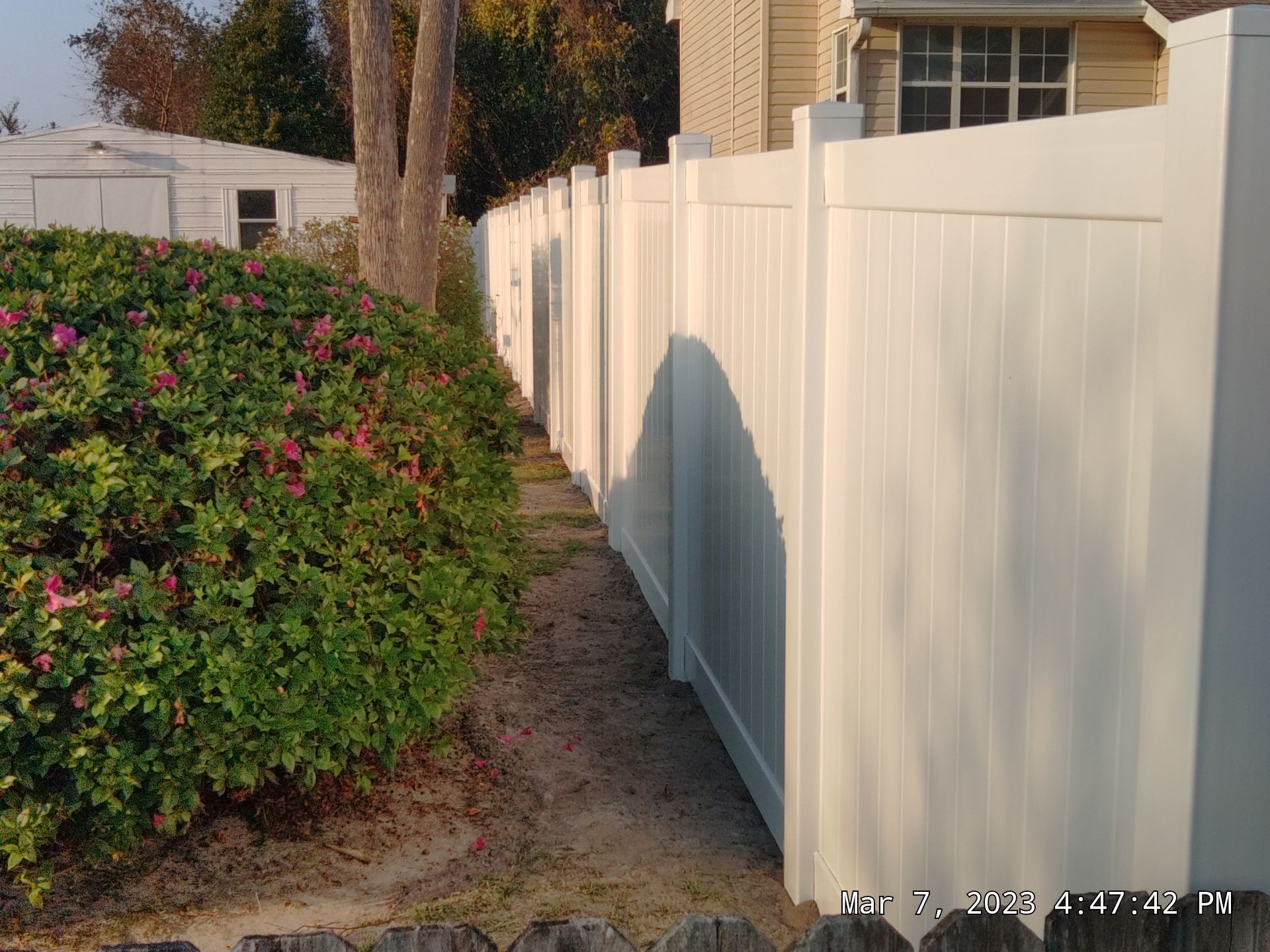 Fence Installation using White Vinyl by Hip Square Fence Inc.