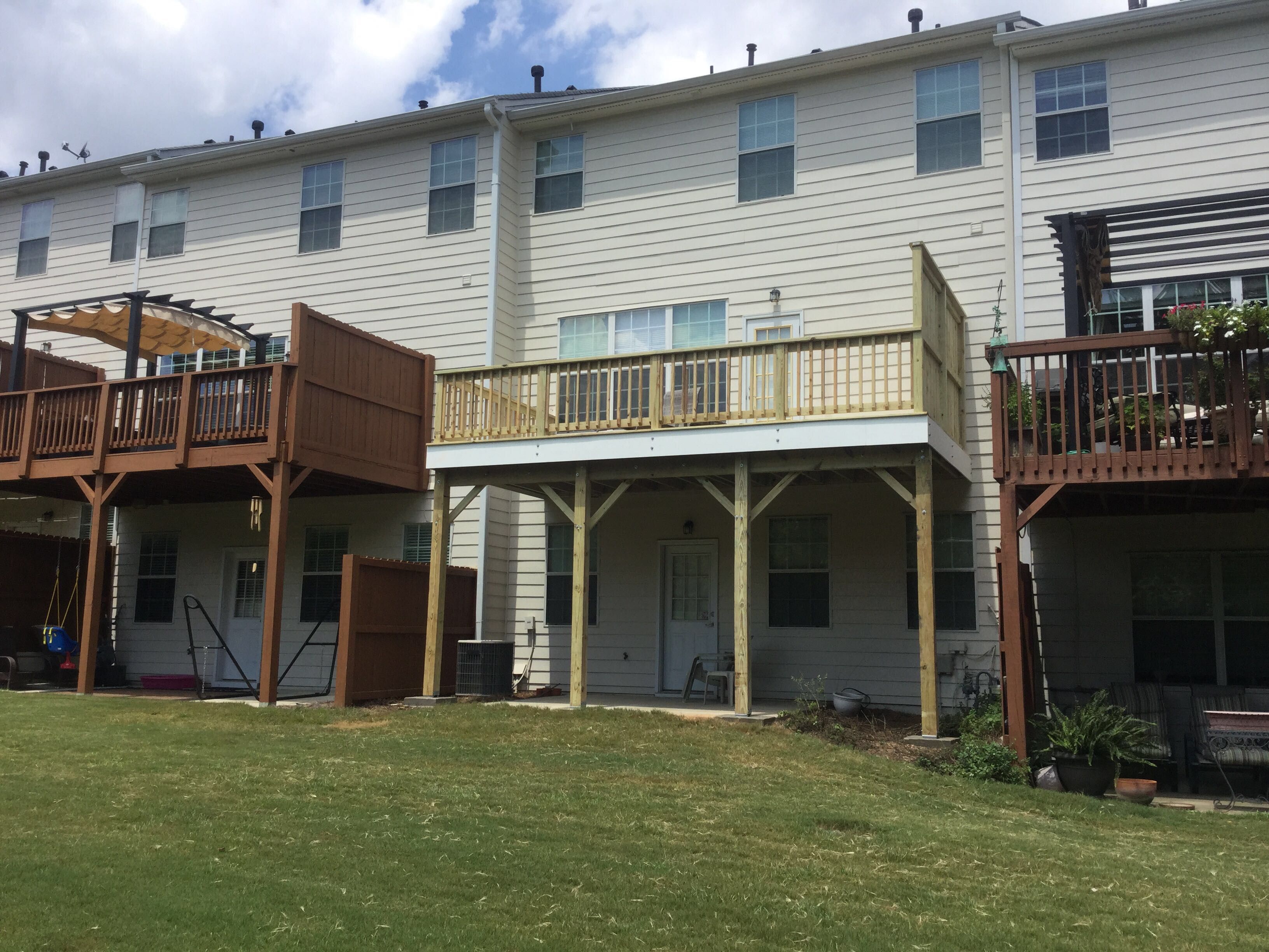 Elevated Pressure-Treated Wood Deck Replacement for Atlanta Townhome by Swift Home Renovations