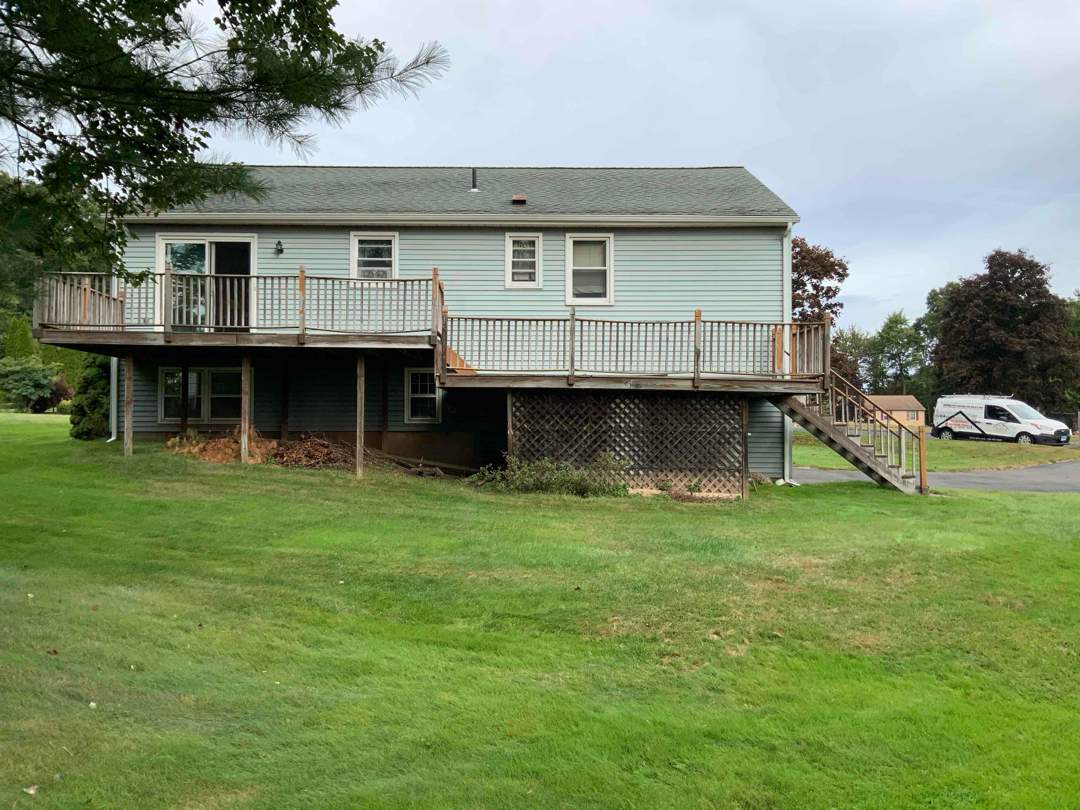 Deck replacement with Trex Select Saddle and White Select T rail. by DiGiorgi Roofing and Siding Inc