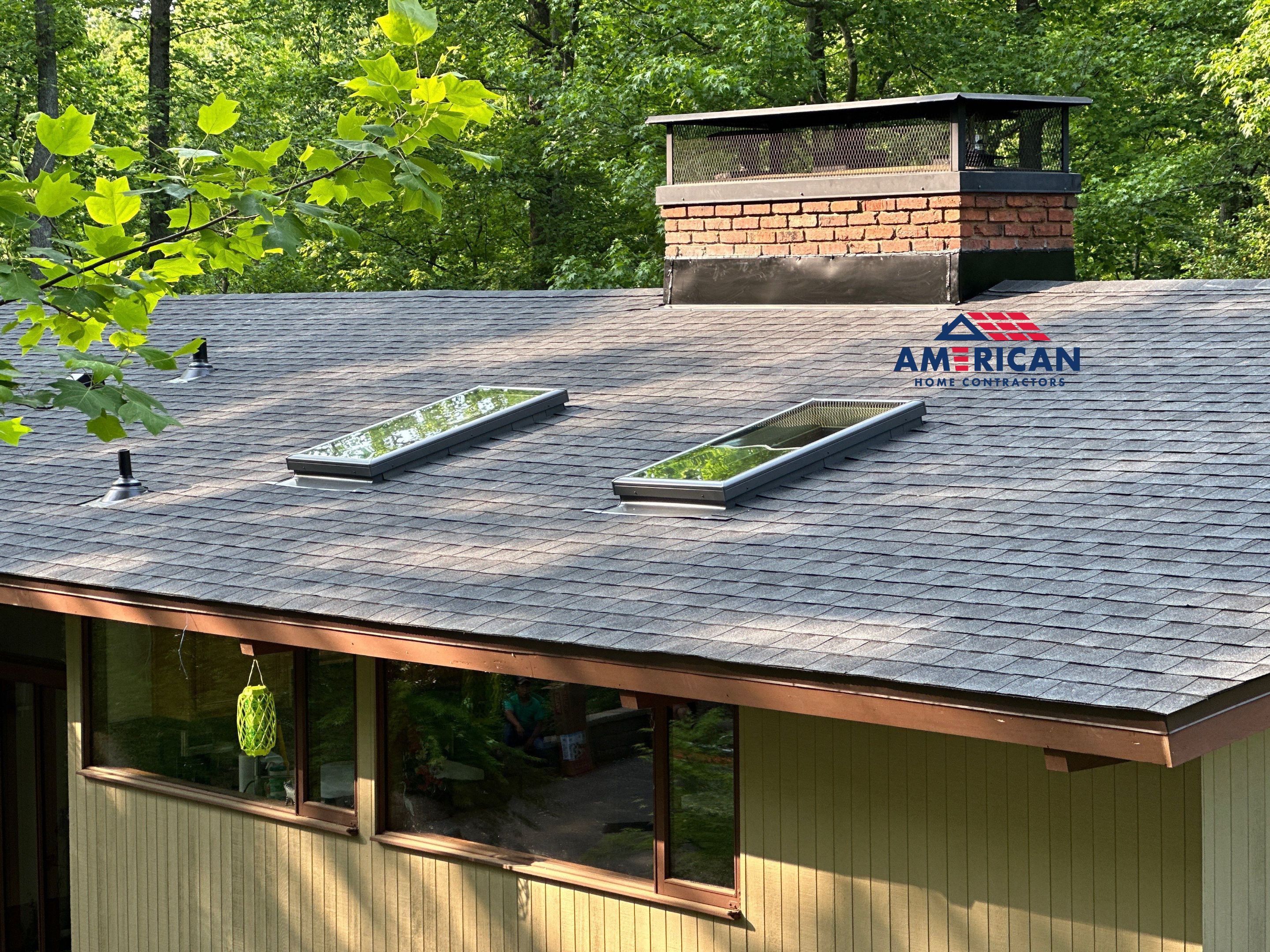 Acorn Deck House Roof Replacement + Skylight Addition by American Home Contractors