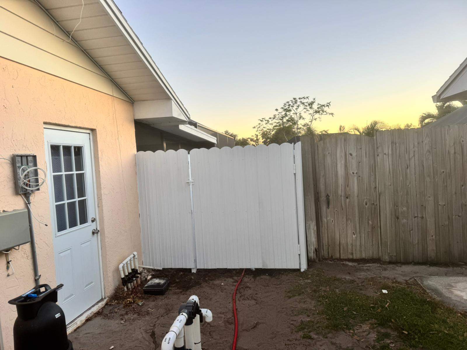 White Vinyl Privacy Fence Installation in Bradenton, Florida by True Fence LLC