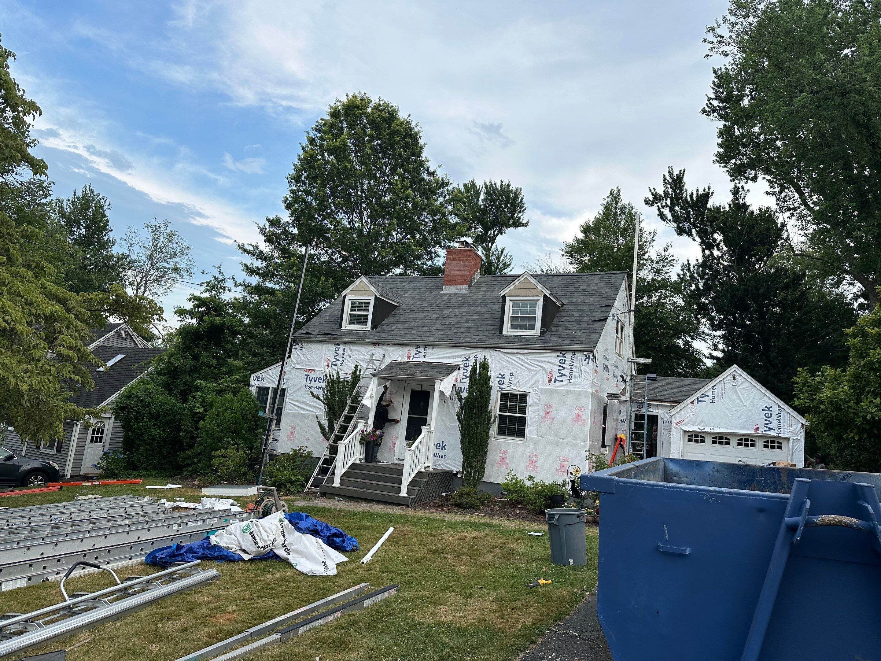 Complete Exterior Estate gray with Pacific Blue Siding by A Plus Exterior