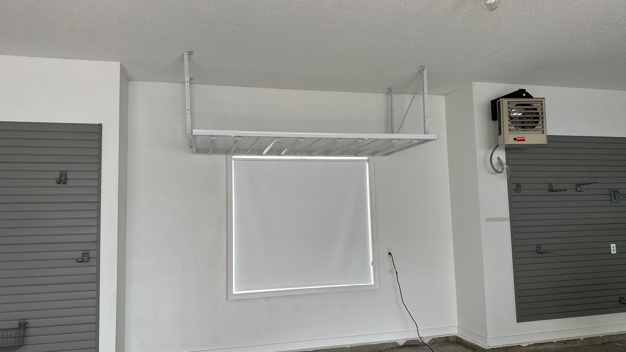 Brooke L. added cabinets for a clean storage look by Banner Garage