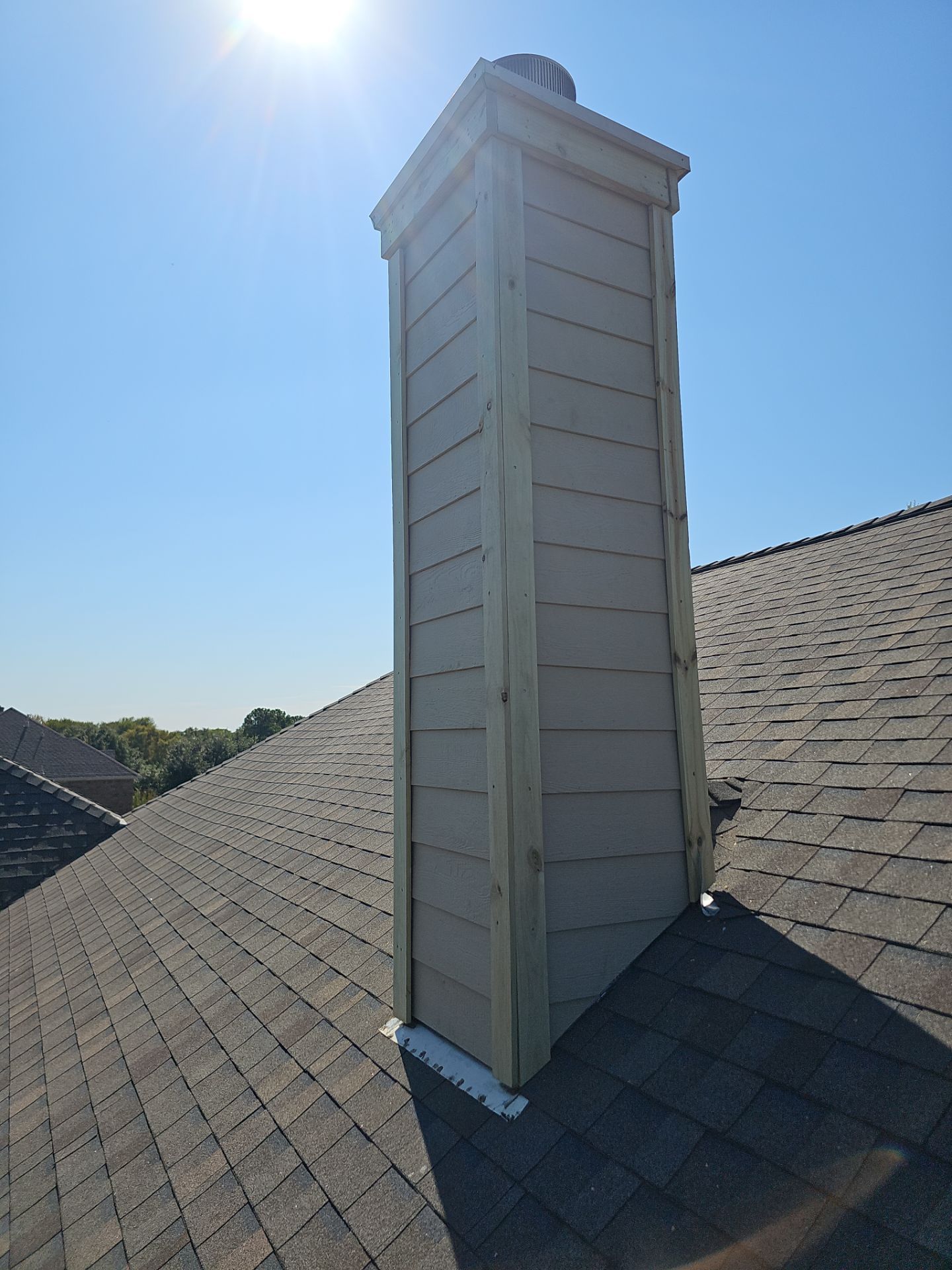 chimney repair using lap engineered treated composite siding. by road roofing llc