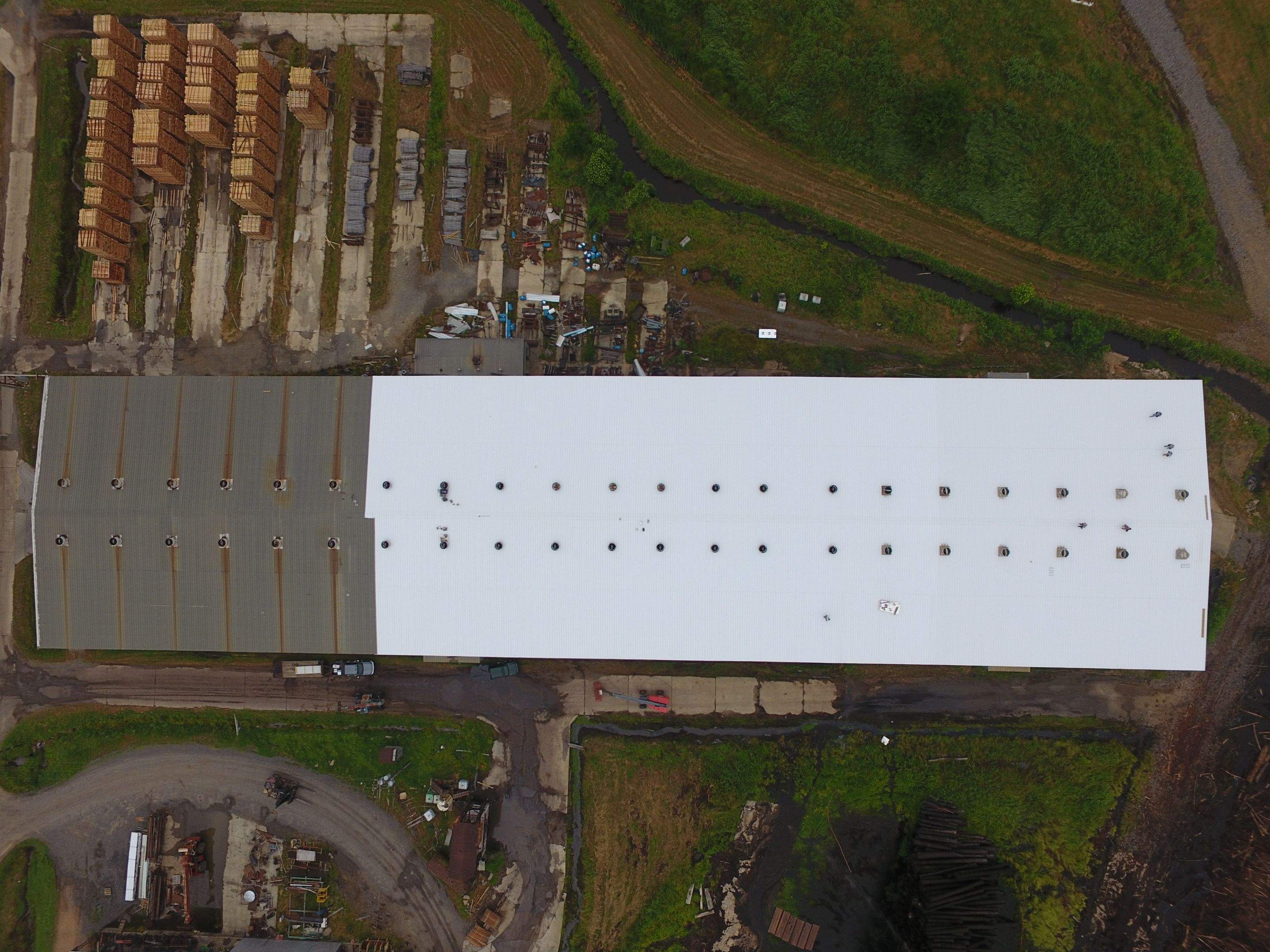 Commercial Roofing Installation using Aluminum Roofing panels by Hostetler Roofing