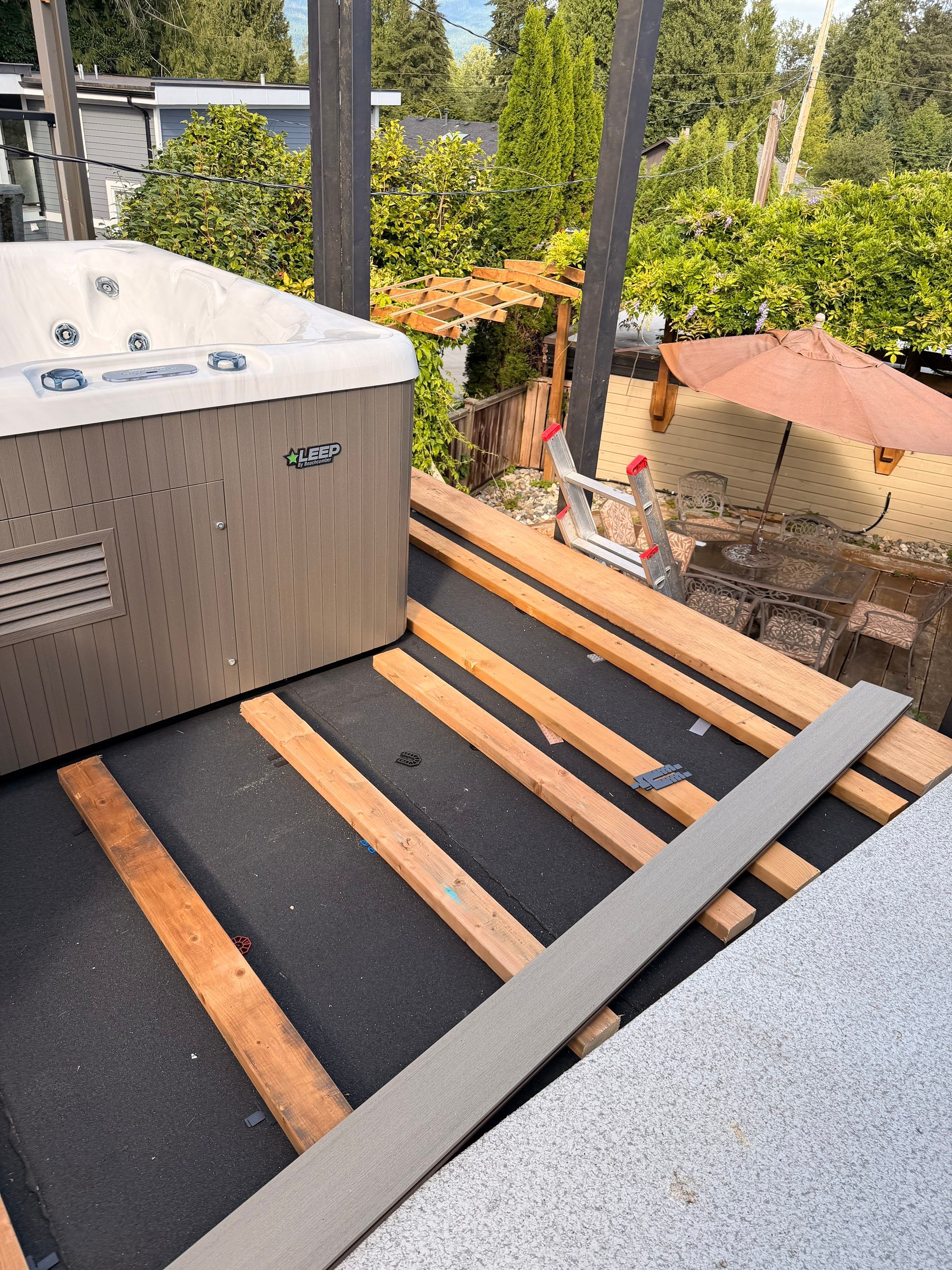 New Composite Deck with glass railing in North Vancouver by YVR Construction Group