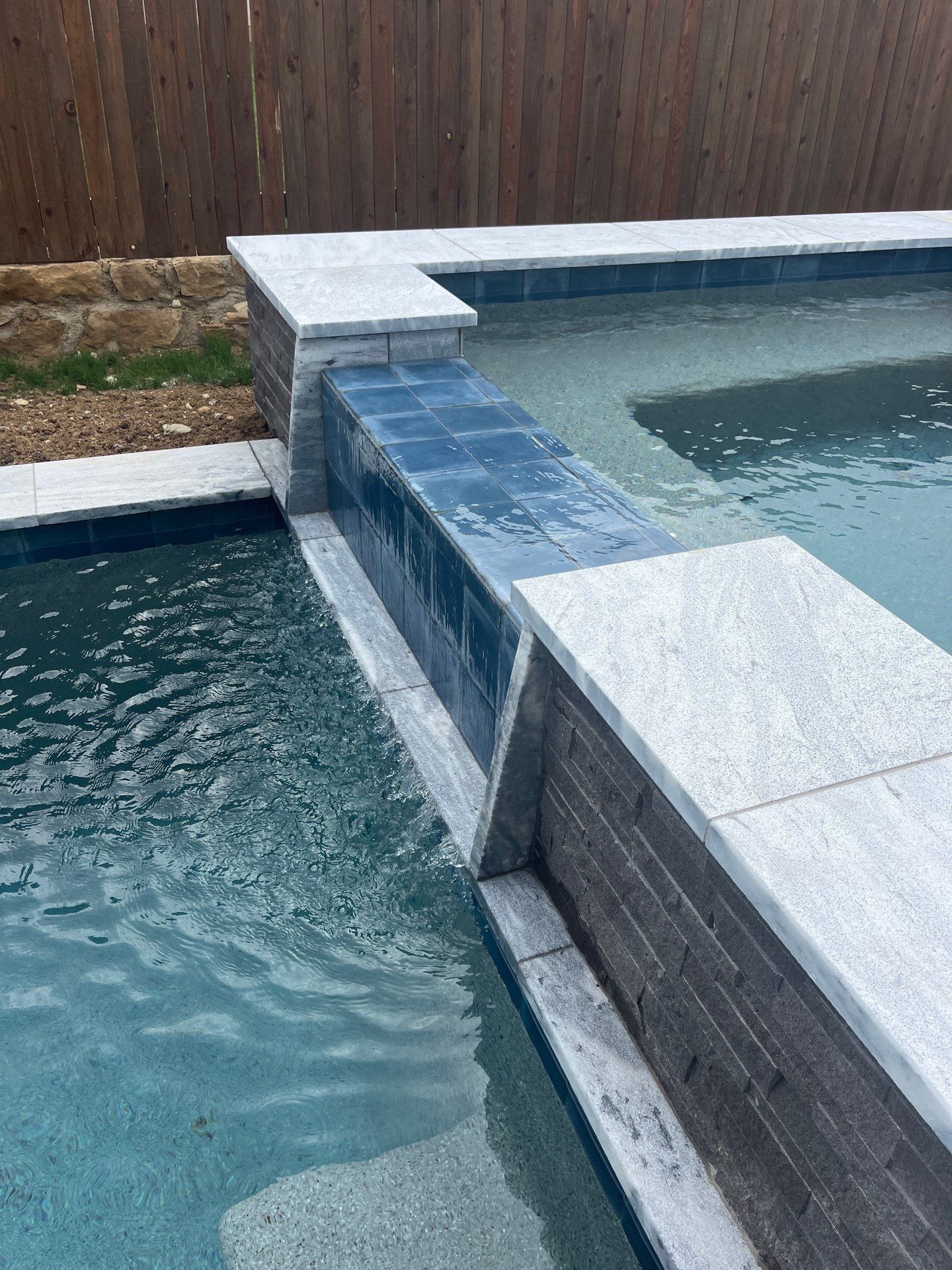 Geometric Pool with Raised Spa and Sheer Descent Waterfall by Pinnacle Pools and Spas - DFW