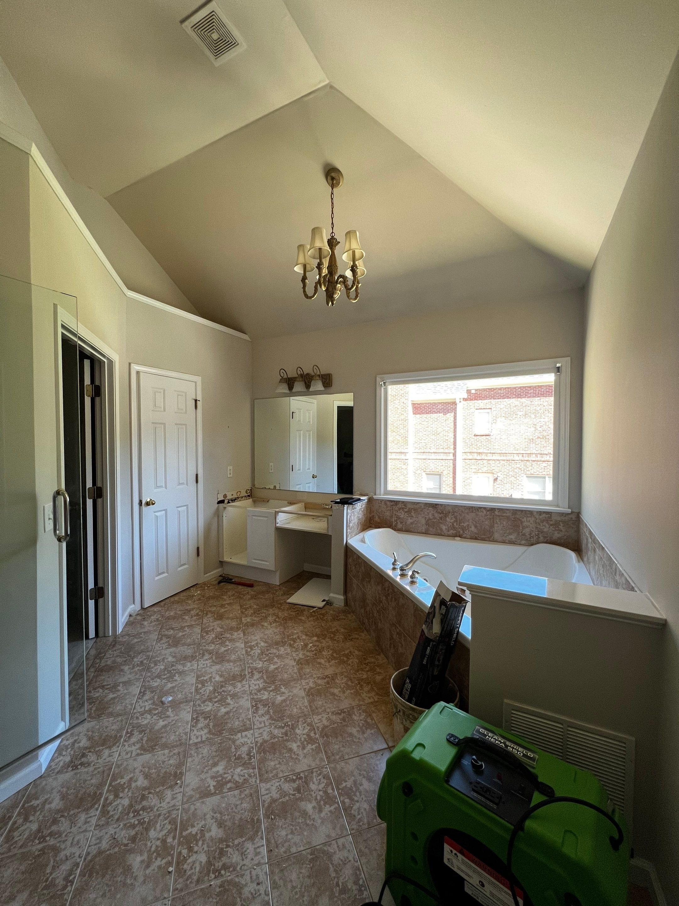 Master Bathroom Renovation with Marble Floor and Freestanding Soaking Tub by Swift Home Renovations