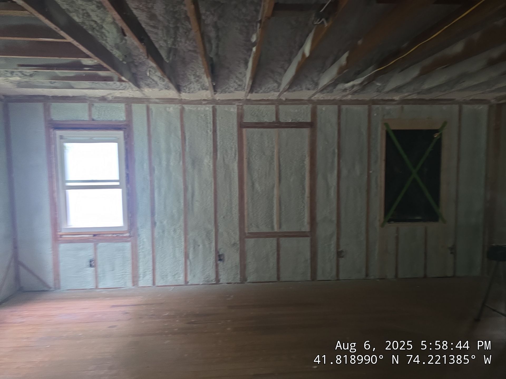 Master bedroom Exterior Walls using open cell spray foam by NYS Foam & Energy