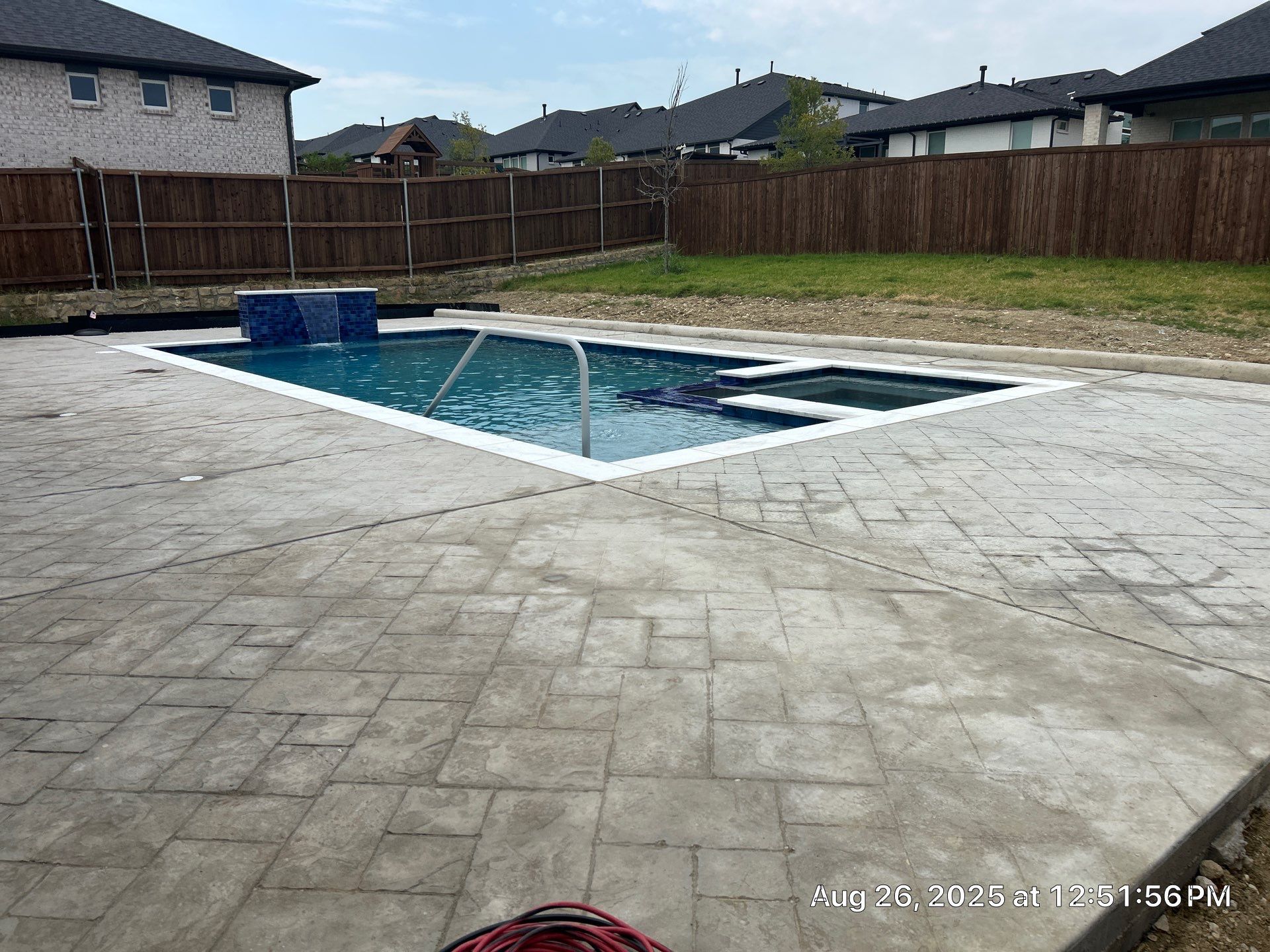 Geometric Pool with Raised Spa and Tanning Ledge by Pinnacle Pools and Spas - DFW