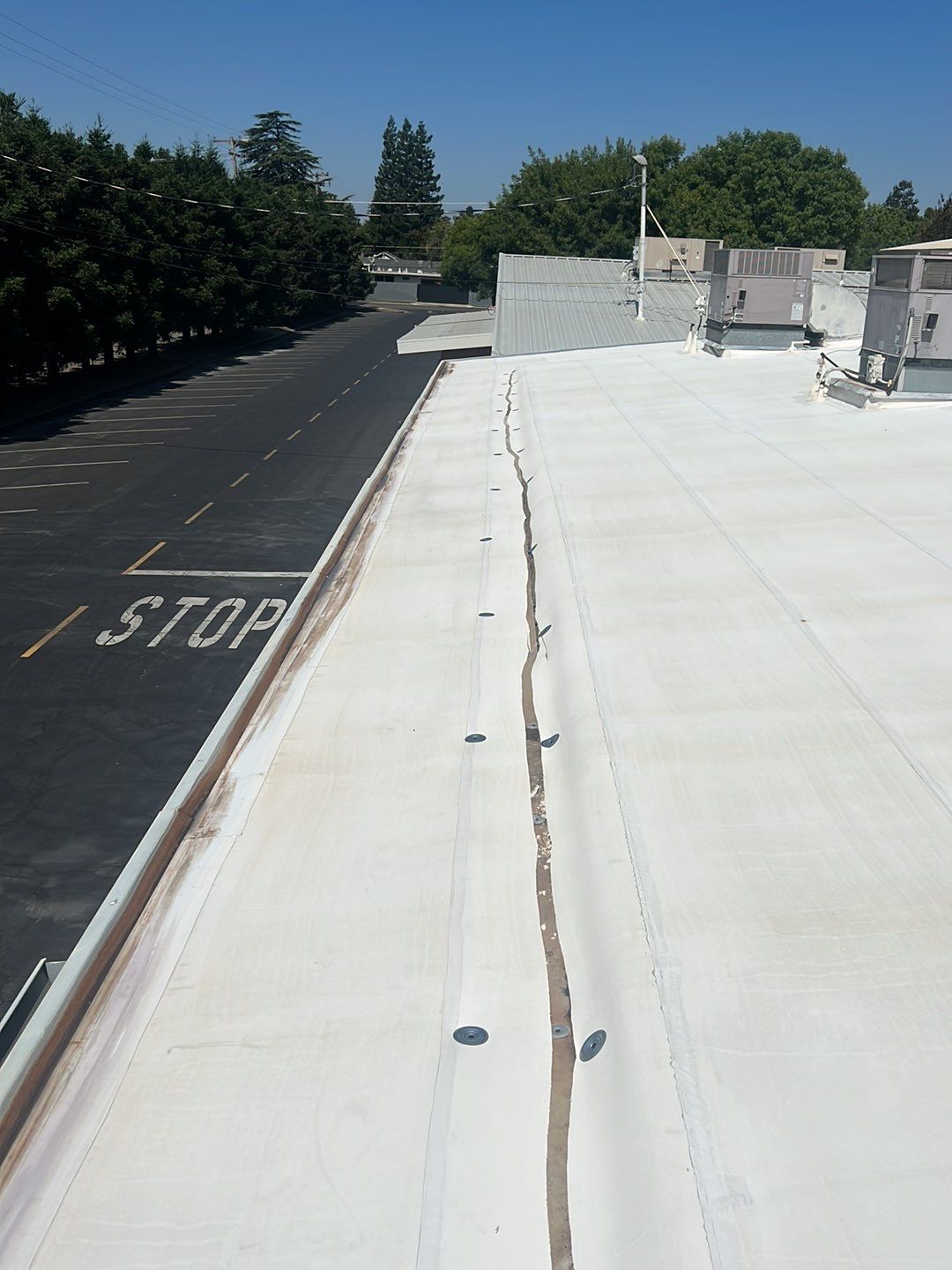 MR Roofing system using Benchmark/PUMA XL coatings over TPO single-ply roofing by Straight Edge Roofing Inc