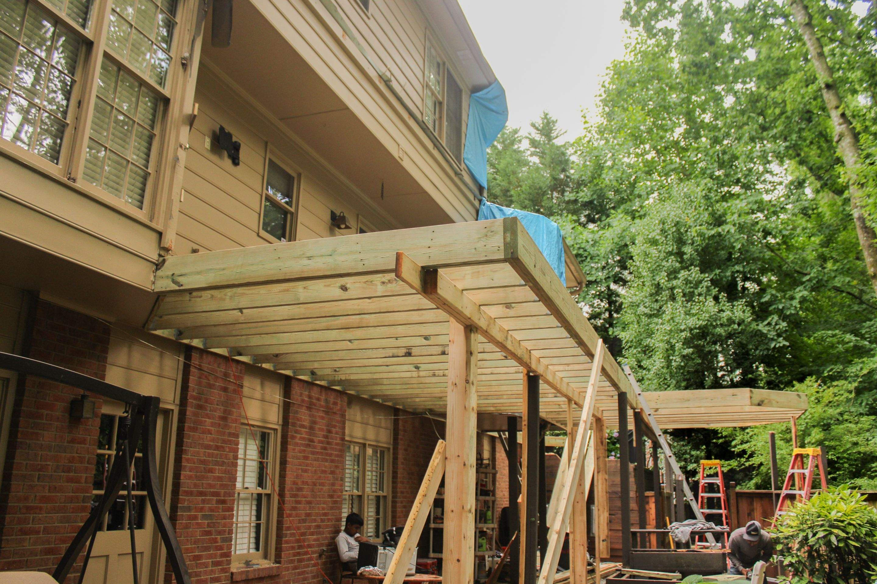 Deckorators Voyage Deck and Shed Style Covered Porch Build with Drink Rail by Nelson Exteriors 