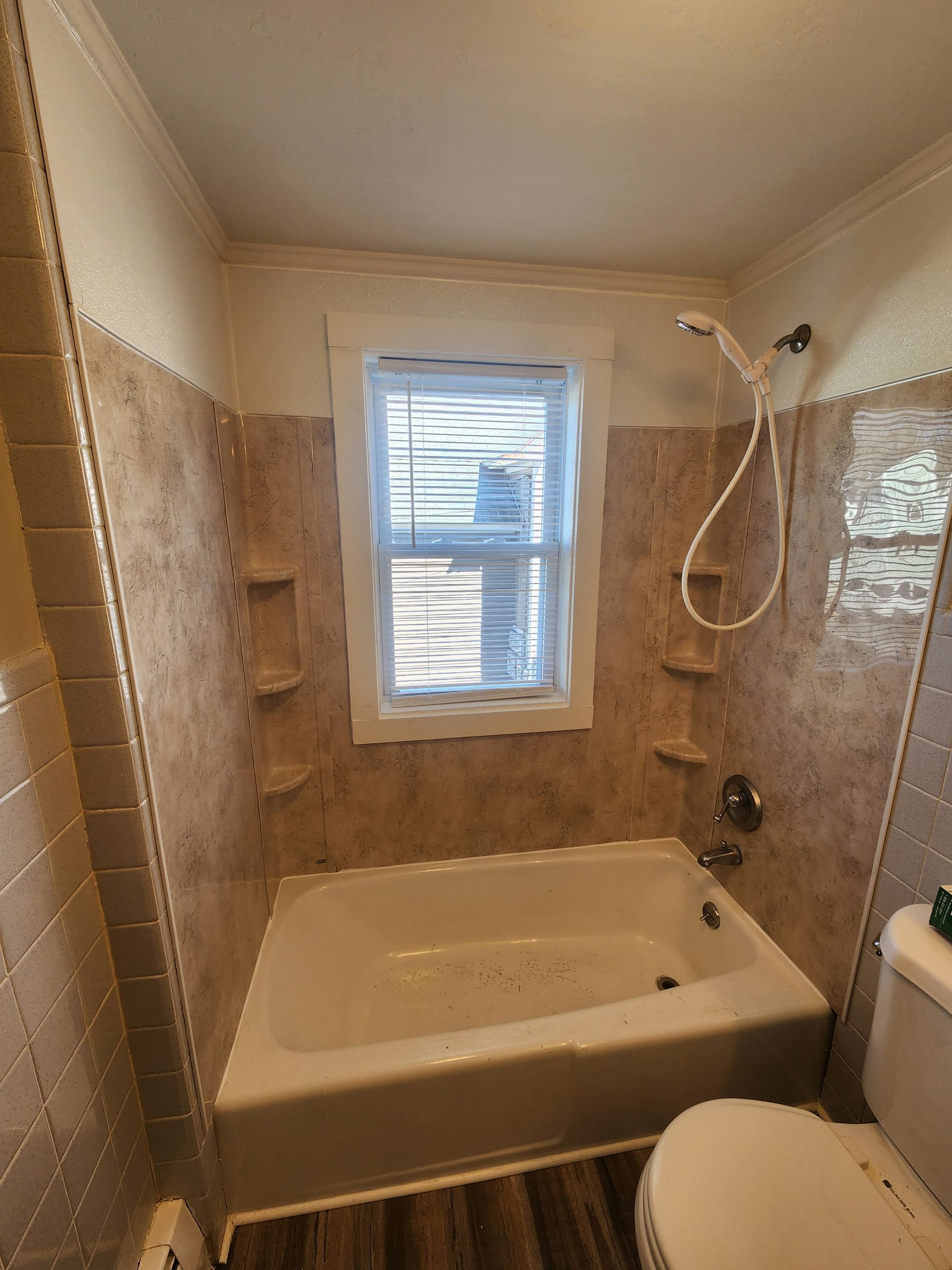 Shower wall and window trim replacement by Freedom Handyman Services
