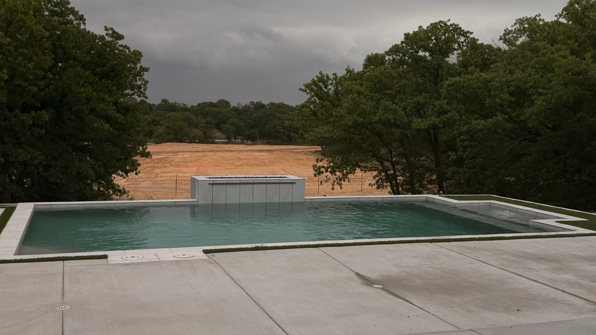 Modern Geometric Pool with Raised Spa and Turf Accents by Pinnacle Pools and Spas - DFW