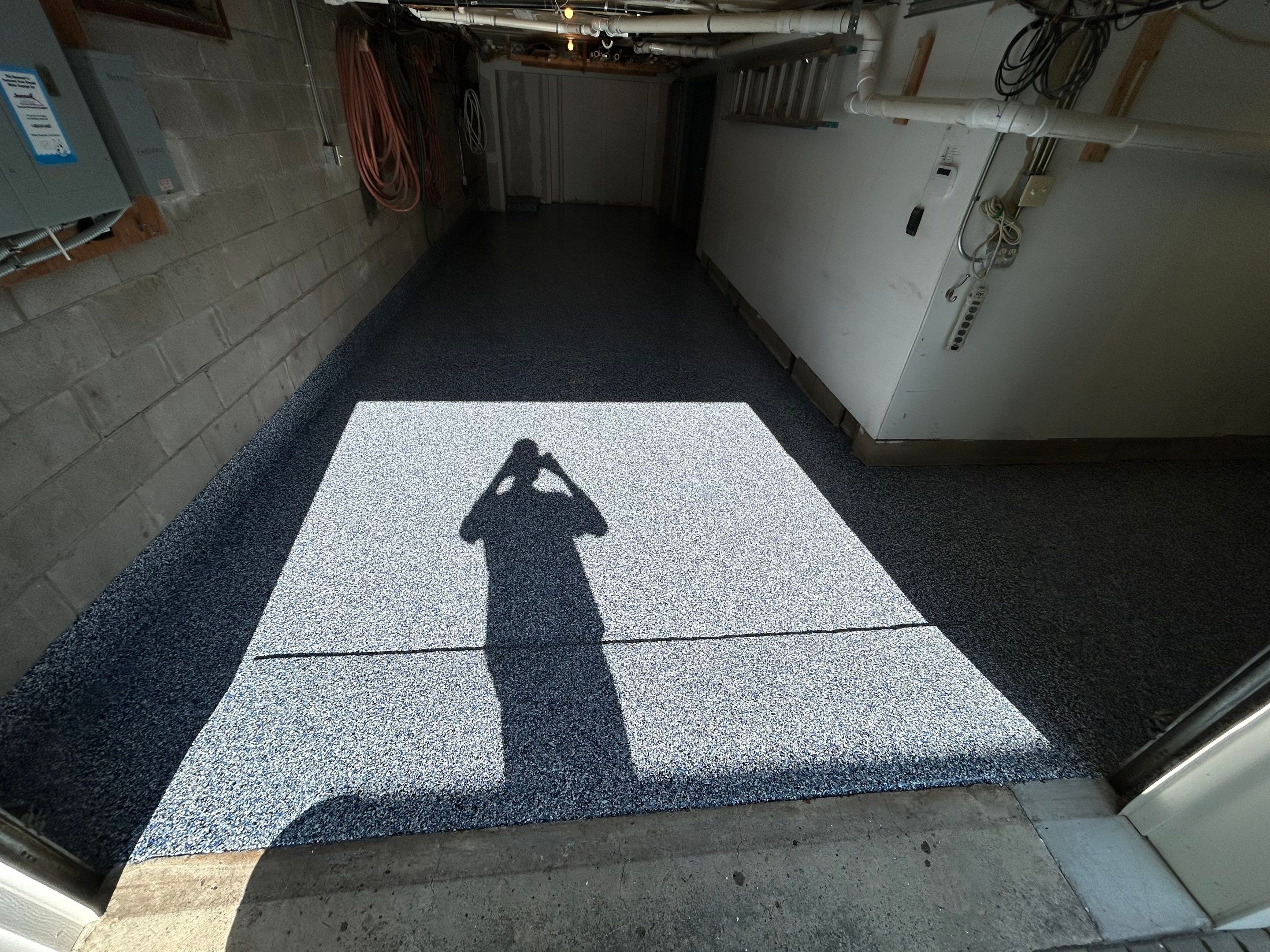 Garage Concrete Floor Coating Transformation by DiGiorgi Roofing and Siding Inc