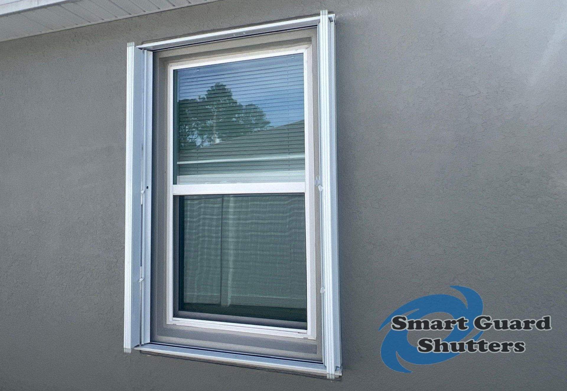 Accordion Shutters in White by Smart Guard Shutters