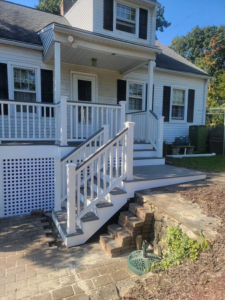 Front deck replacement, Trex tropical Island mist boards and matching cocktail rail, Lattice bottom with access door by DiGiorgi Roofing and Siding Inc