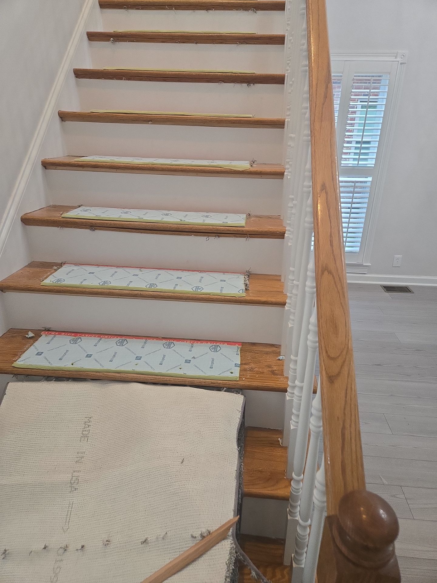 Updated staircase and hallway by Footprints Floors of Nashville
