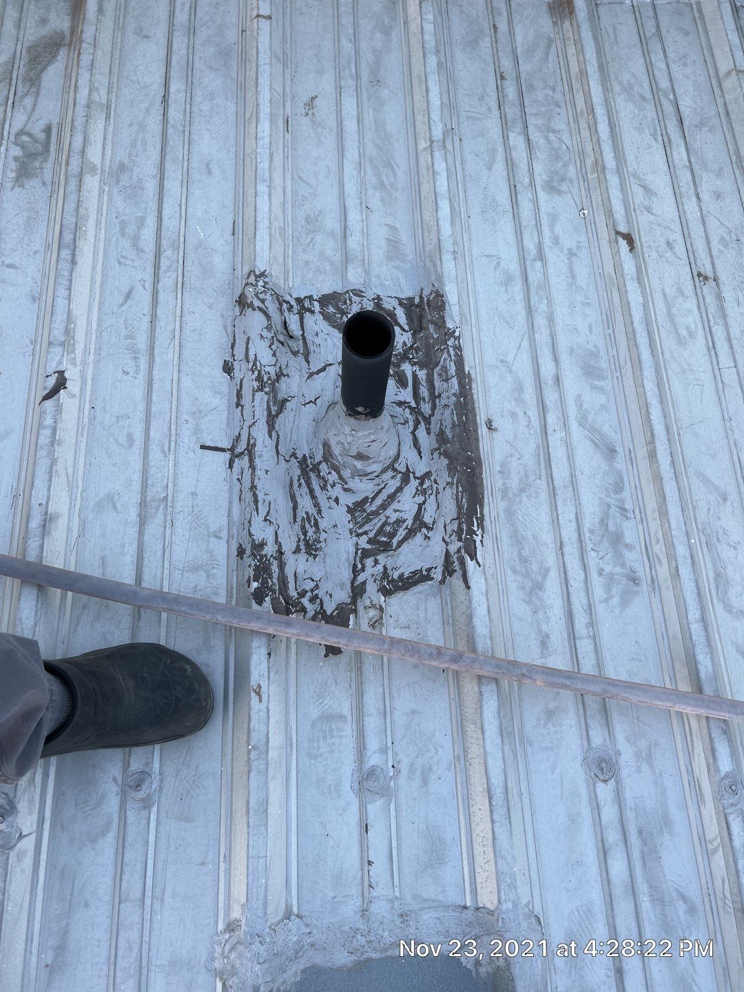 Metal roof restoration on commercial roof using Conklin Benchmark/ PUMA XL acrylic coatings over metal and foam by Straight Edge Roofing Inc