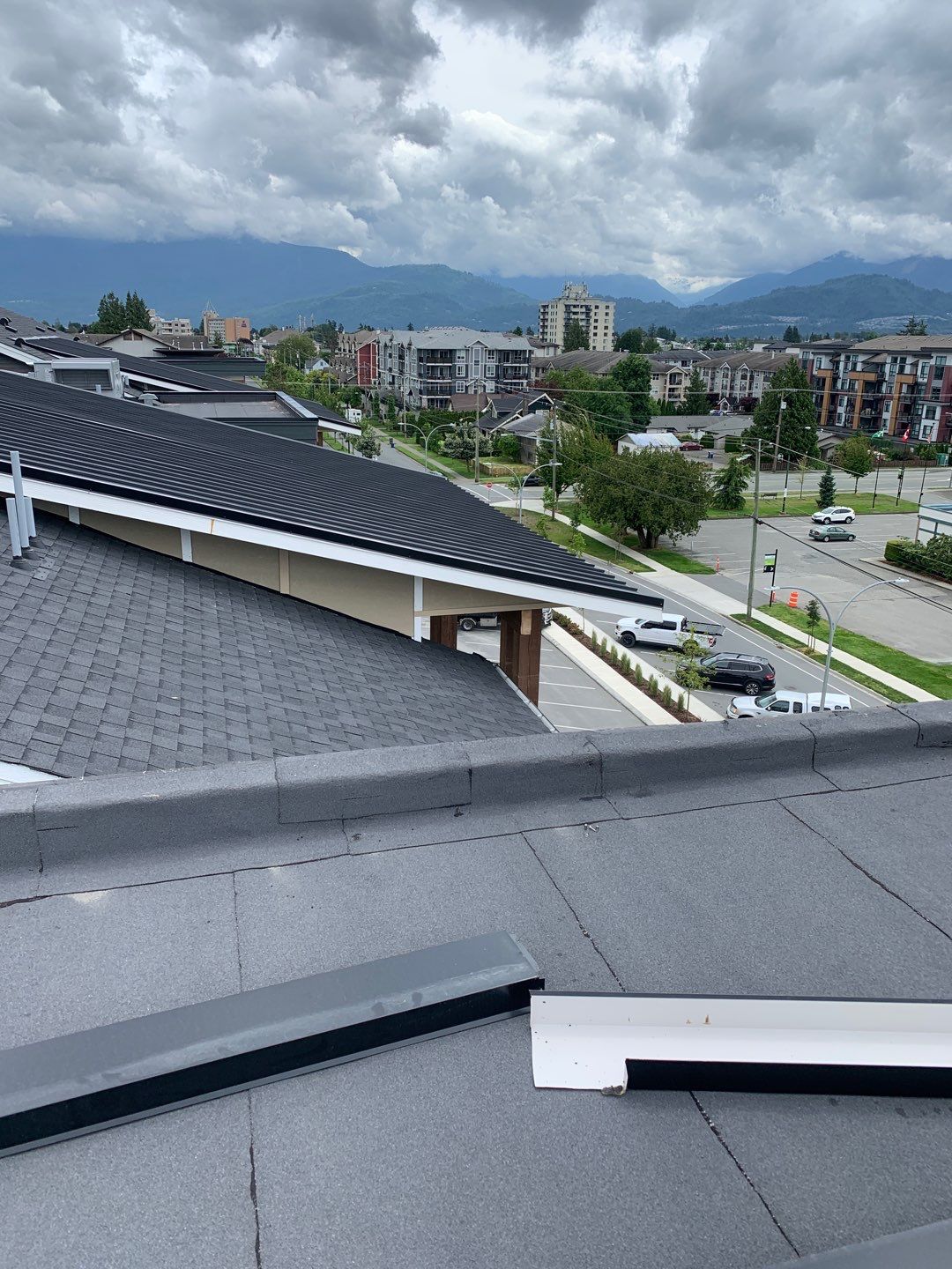 Large apartment with sbs, shingles and prolok metal  by Top Notch Roofing Inc