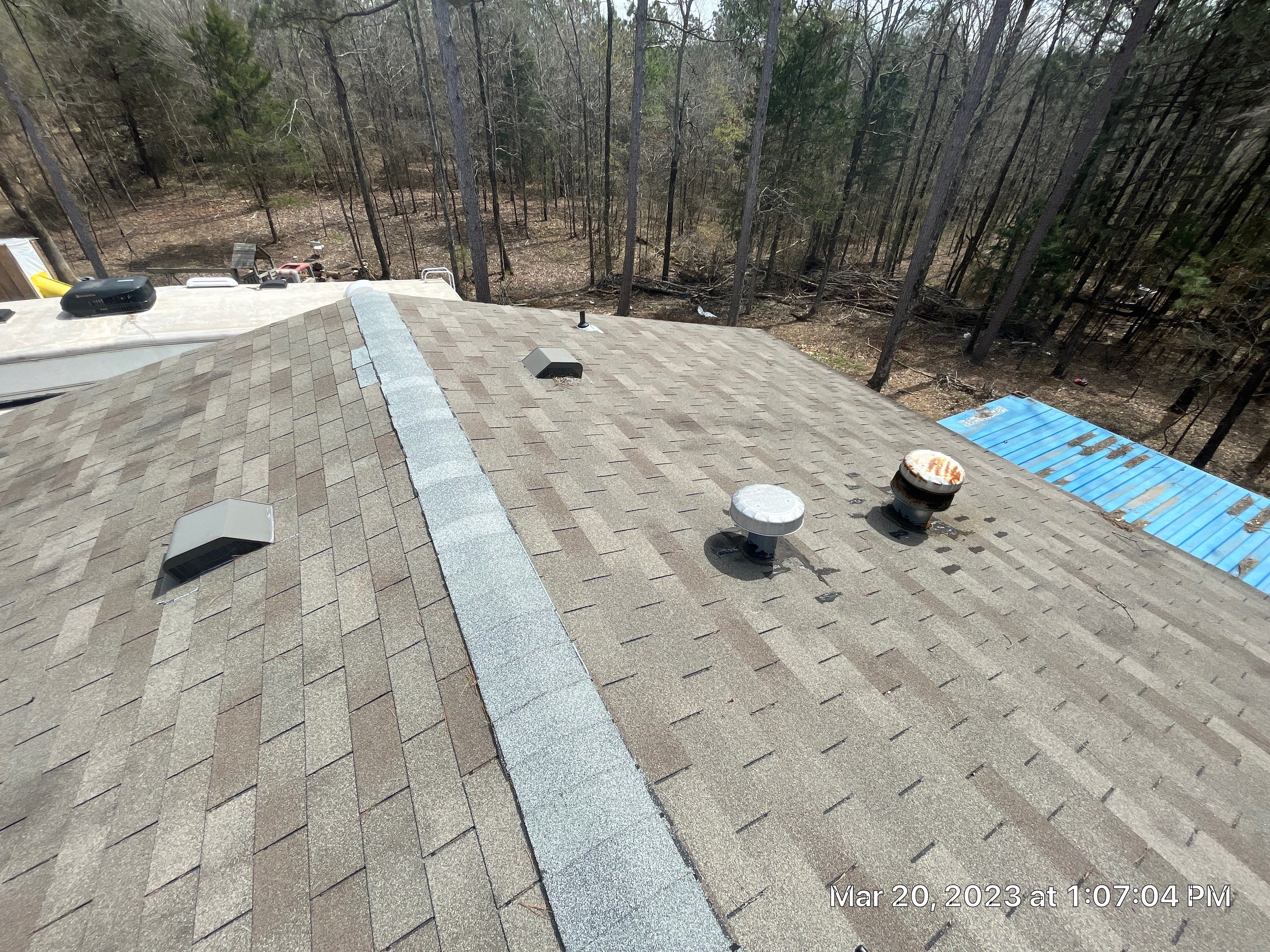 Residential Roofing Installation using 26 Gauge Colored Panels by Hostetler Roofing