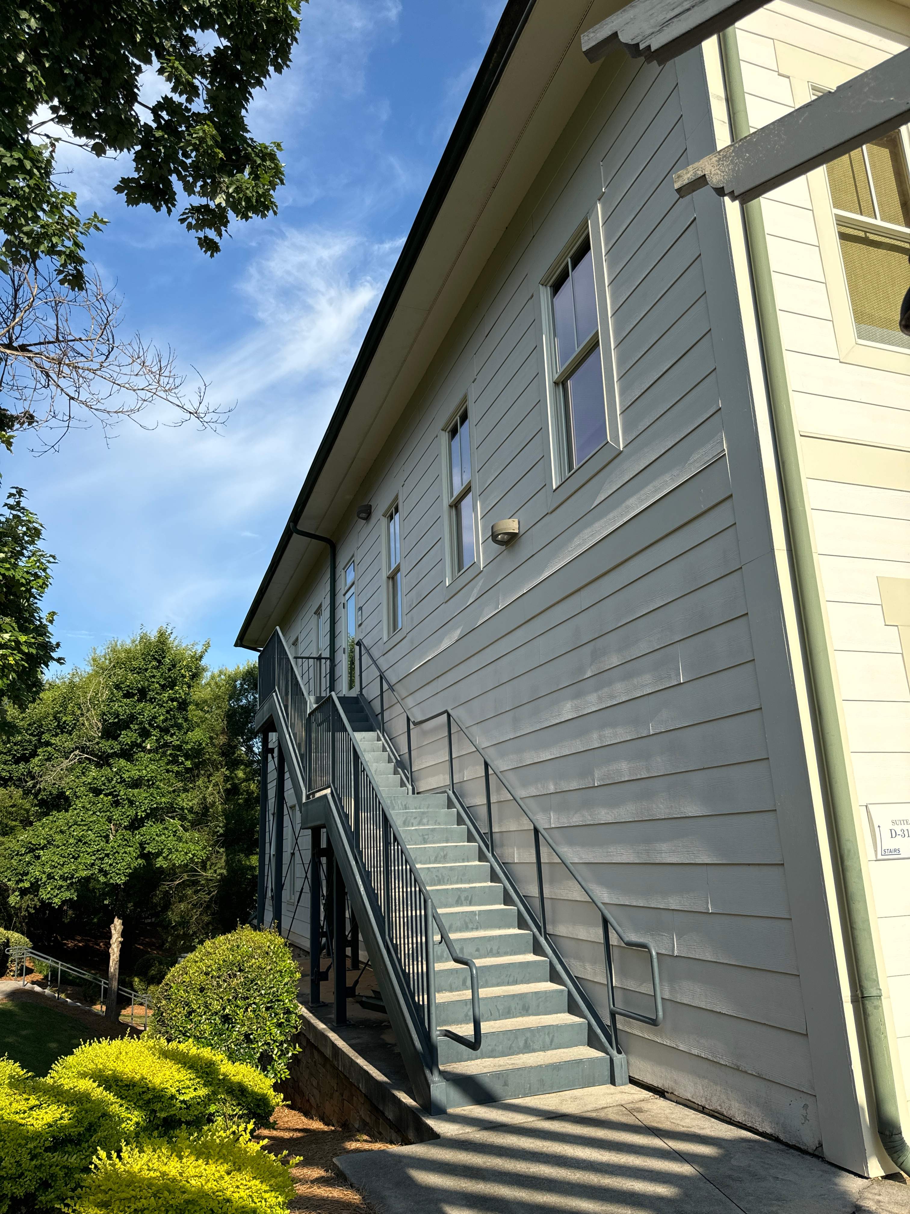 Commercial Exterior & Stairwell Painting – Corner Market by PGP Surface Solutions, LLC