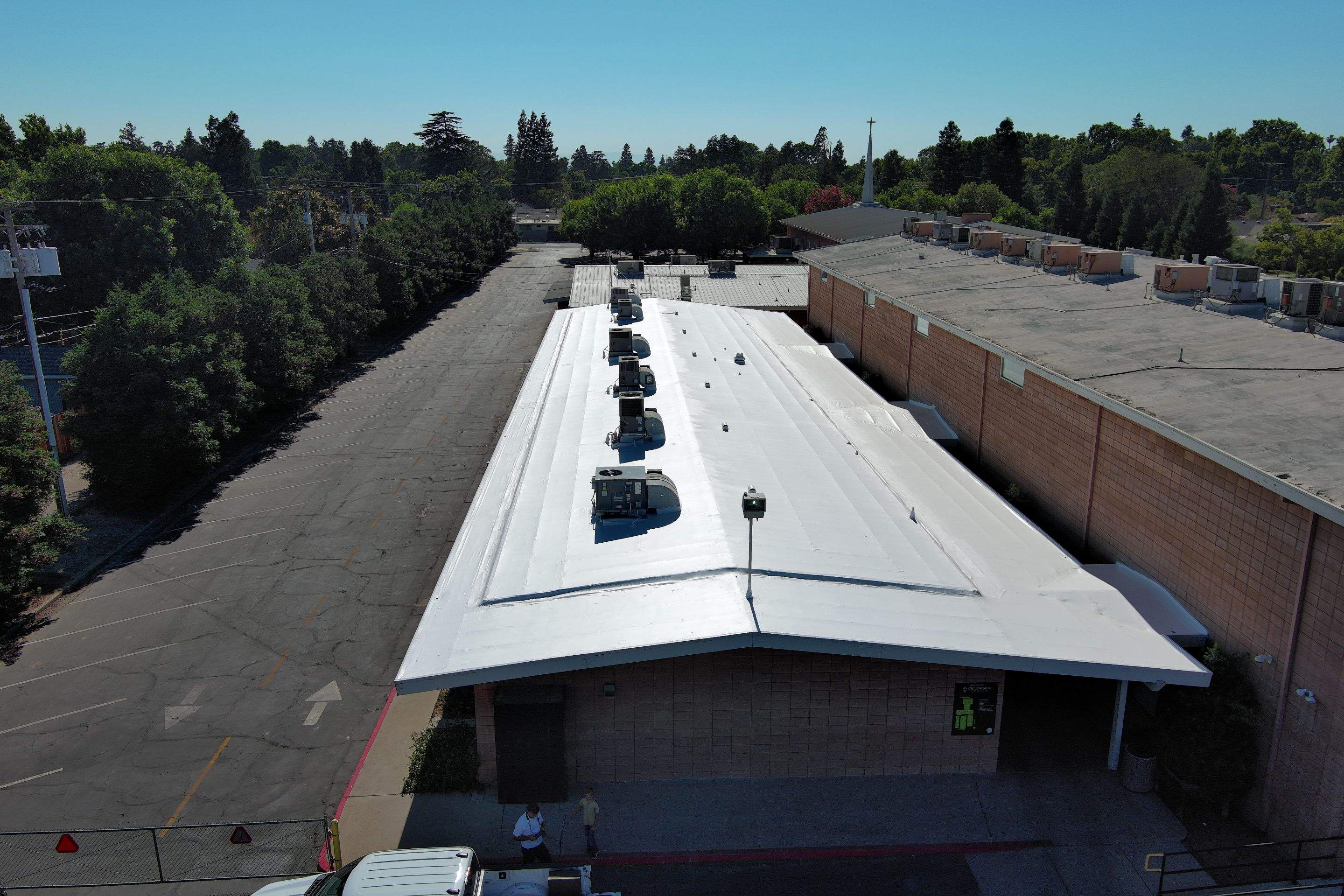 MR Roofing system using Benchmark/PUMA XL coatings over TPO single-ply roofing by Straight Edge Roofing Inc