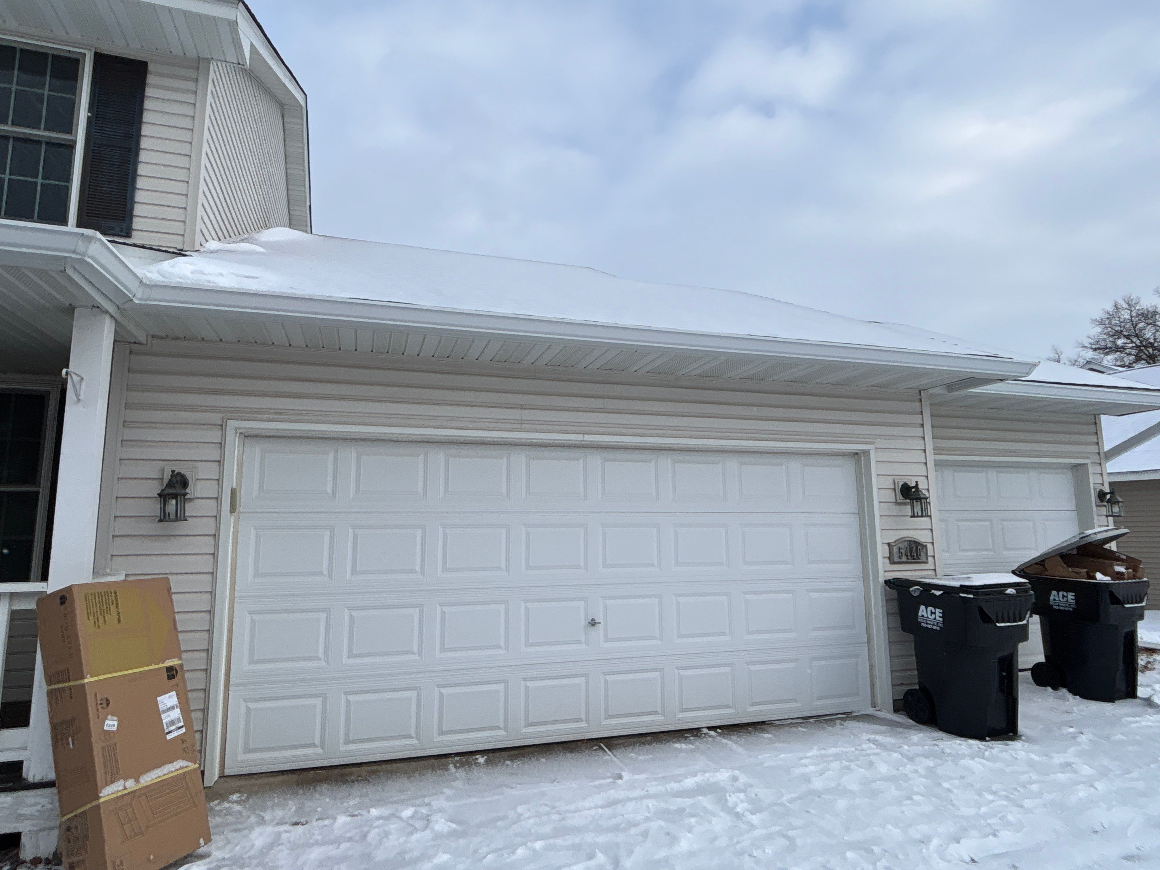 White Seamless Gutter and Downspout Installation in Big Lake by Next Level Seamless Gutters / Exteriors Inc.