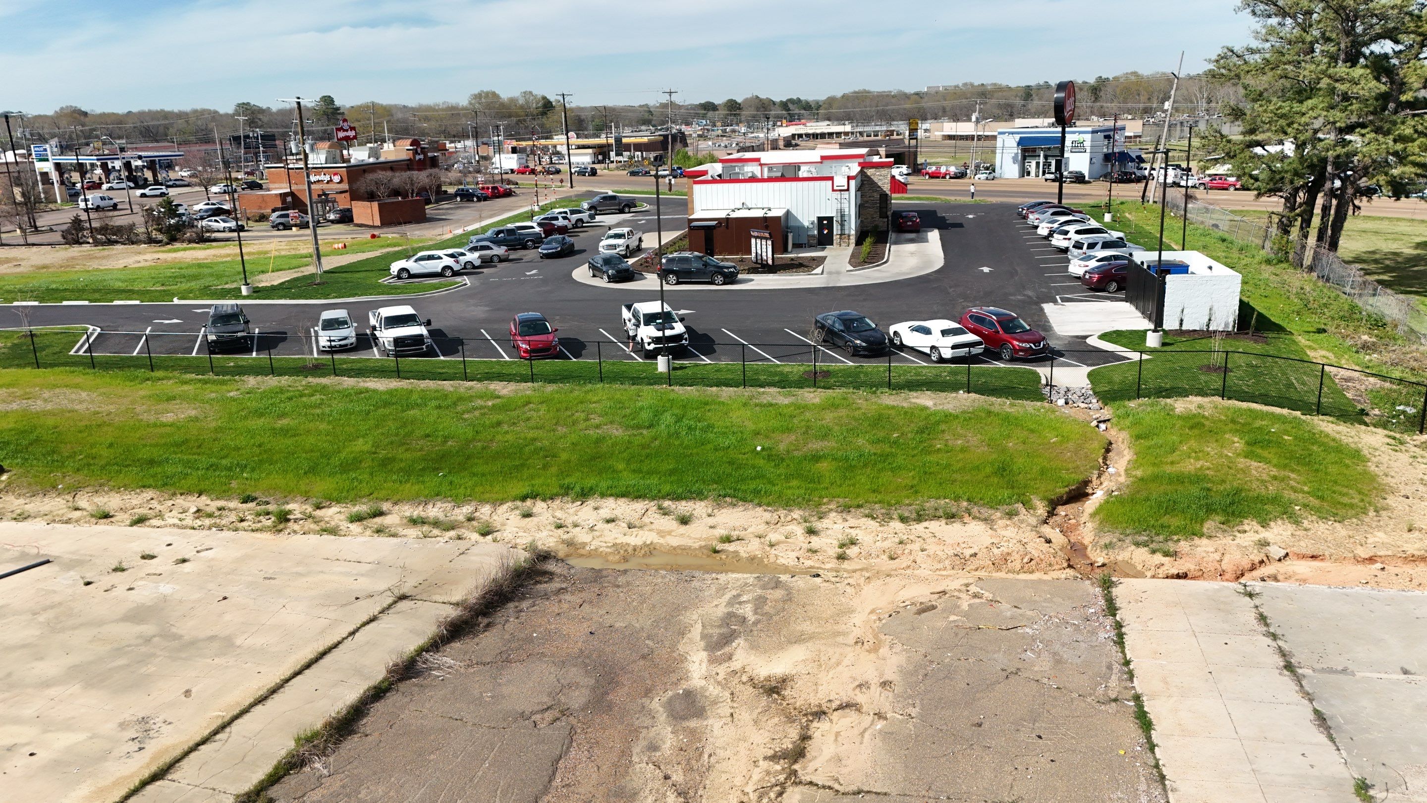 6' Black Chain Link Fence & Concrete Block Dumpster Enclosure by Roberson Construction LLC