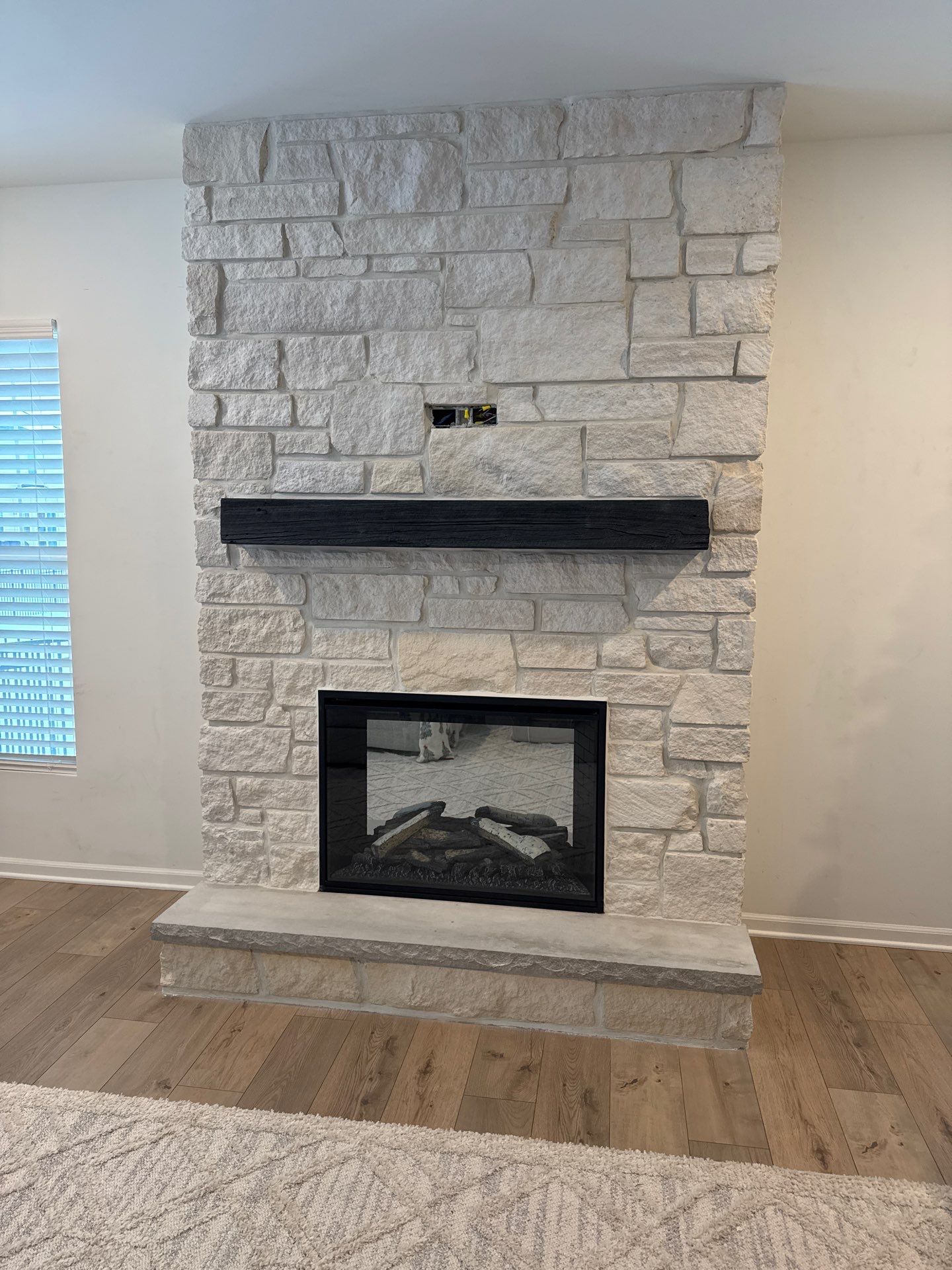 Electric Fireplace & Stone Veneer Installation by Leonard and Sons Building Services, Inc.