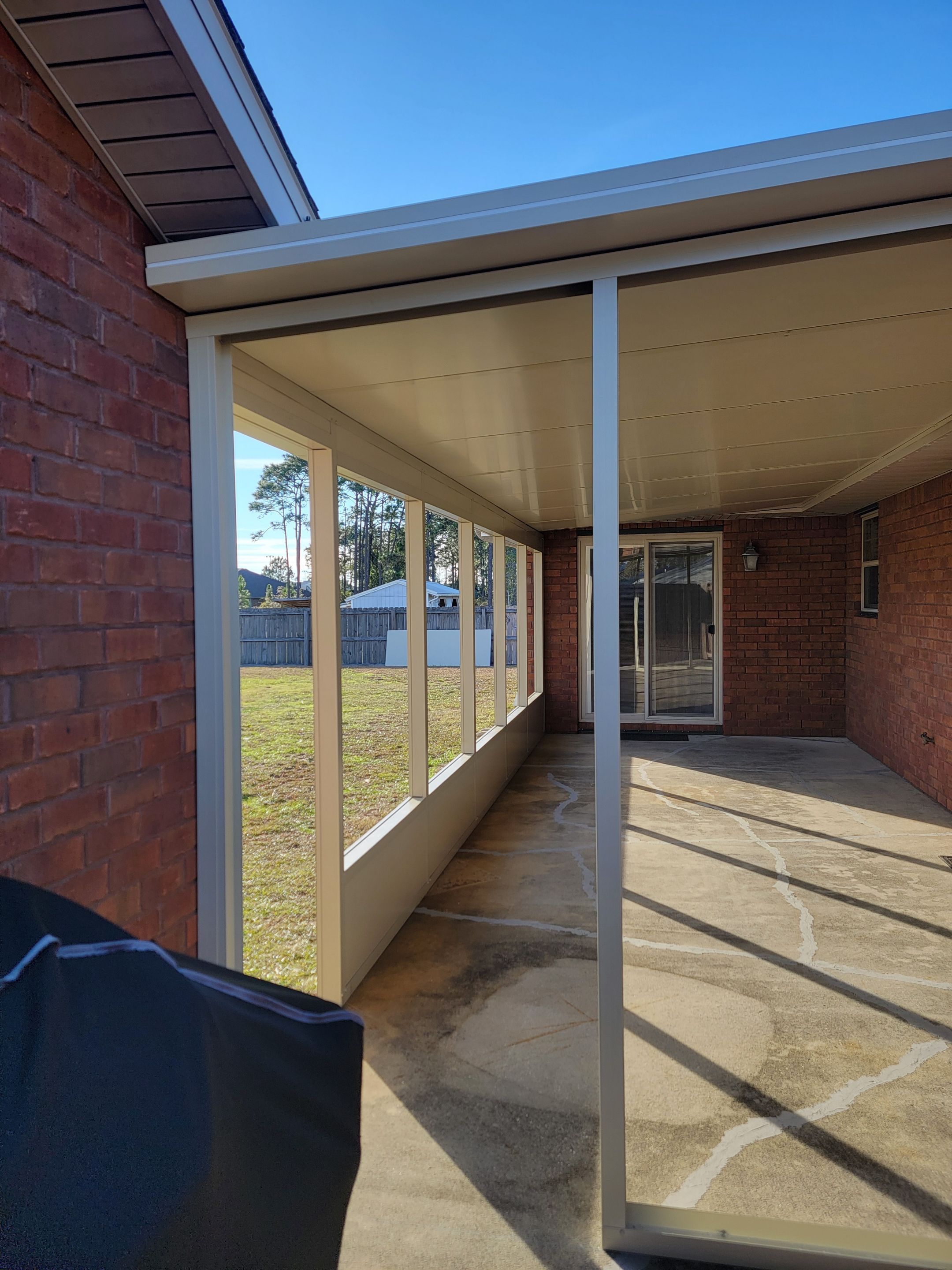 Enclosure w/Vinyl Windows using Colorbeam by Titan Sunrooms